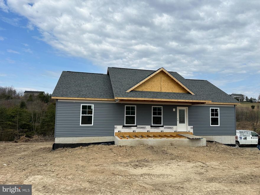 Stunning New Construction Rancher on 2 Acres with Pond Frontage!

This must-see 3-bedroom, 2-bath rancher offers 1,800 square feet of beautifully designed living space with an attached garage. Plus, it features a walkout basement already framed for a 4th bedroom and full bath, bringing the potential living space to over 2,500 square feet!

Home will be completed in the next 45-60 days! Inside, you'll love the spacious kitchen featuring a large island, breakfast bar, and elegant white cabinets—perfect for entertaining or everyday living. Main-level laundry adds convenience, while the large, finished family room in the basement provides extra space for relaxation, entertainment, or a home theater. Plus, there are additional laundry hookups in the basement for even more flexibility. Basement would make a great in-law suite.

Situated on a picturesque 2-acre lot, this home offers the perfect balance of open space and wooded privacy. The shared pond, with substantial frontage on this property, provides a tranquil spot for fishing or simply enjoying nature.

Located just outside Capon Bridge, WV, this home offers the serenity of country living while being just a short drive to Winchester, VA, for shopping, dining, and other conveniences.

Step outside to your spacious rear deck, perfect for hosting barbecues or relaxing as you take in the natural beauty. Love wildlife? Enjoy watching deer roam freely and stop for a drink at the pond.

Need extra storage or a workshop? A charming brick outbuilding, original to the property, is in great condition and would make an excellent woodshop or storage space.

Available for viewing NOW! Call your agent or schedule a private tour before it’s gone!

Don’t miss out—this gem won’t last long!