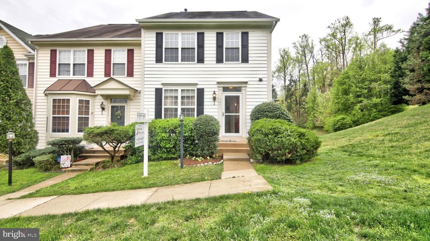 This gorgeous end unit town home is nestled in the highly desired Lake Ridge area.  This extra large home includes freshly painted walls, a bump out on each level, walk-out fully finished basement, enormous kitchen, spacious deck and much more.  The master bedroom has a sitting room/ office area with a skylight window.  Tons of natural light gives this home the presentation it deserves.  Don't miss out on this private lot.  It won't last long.