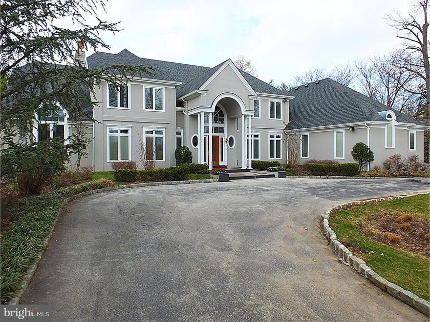 This beautiful 2-story French Colonial home features 5 bedrooms, 6 full and 2   bathrooms.  The first floor features a new chef's kitchen with quartz counters, oversized center island and Sub-Zero, Wolf and Miele appliances; first floor with 9' ceilings have rooms filled with natural light, beautiful hardwood and radiant marble floors and a great floor plan.  Other main floor highlights include an elegant 2-story foyer with stunning wood beamed ceiling; formal living and dining rooms; office; first floor master suite; and 2-story family room. 2nd floor highlights include 4 bedrooms, each with a bathroom and walk-in closets plus a playroom/bonus room with French doors opening up to a balcony overlooking the family room.  The fully finished lower level includes great recreation space with a billiard area, exercise room, storage and a full bathroom. The property features a newly updated patio, in-ground pool, circular driveway, 3 car garage, full house generator and is surrounded by multi-million dollar homes on a wonderful street in Lower Merion's award winning school district.