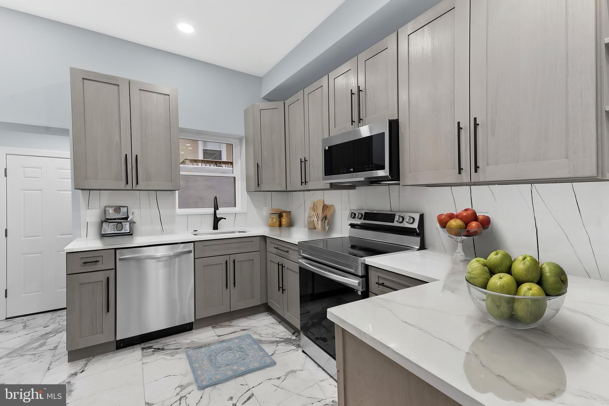 Located just off Broad Street with convenient access to public transportation, local shops, and restaurants, this spacious and fully renovated home offers five true bedrooms spread across three finished levels of living space. From the moment you step inside, you'll notice the attention to detail throughout—modern flooring, recessed lighting, and a clean, contemporary design that flows from the living area into a beautifully upgraded kitchen with stainless steel appliances and stylish finishes. The upper levels provide ample room for a large household or anyone who needs space for guest rooms, offices, or creative use, while the finished basement adds even more versatility for entertaining, relaxing, or working from home. Whether you're looking for a primary residence or an investment opportunity in a growing neighborhood, 1322 W. Wingohocking offers a rare combination of size, style, and walkability in the heart of North Philadelphia.