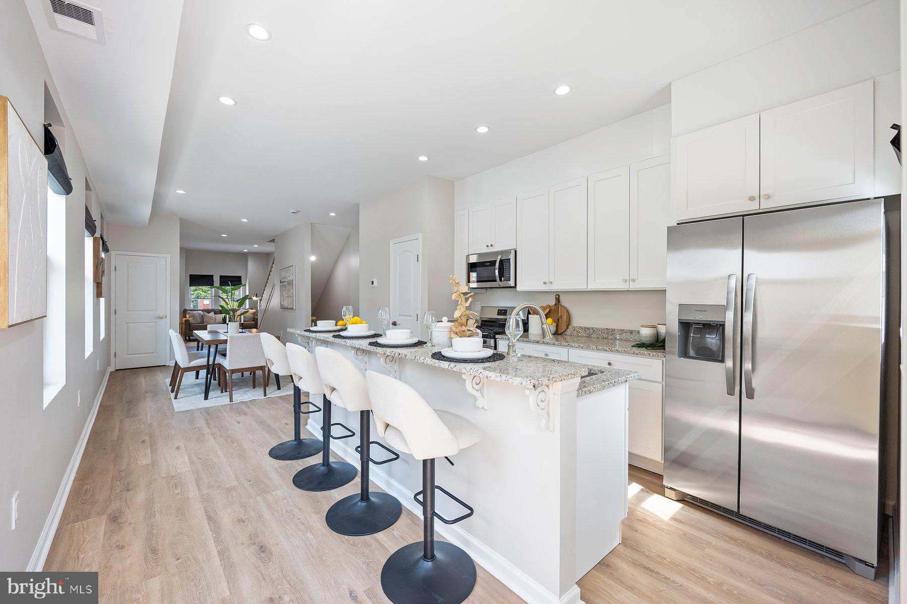 Urban Sophistication Meets Modern Comfort
Welcome to 19 N Smallwood St — a fully renovated home that blends modern luxury with unbeatable convenience. Located just minutes from downtown Baltimore, major hospitals, top universities, and with easy access to Washington, D.C., this home is ideal for professionals, students, and city lovers alike.
Step inside to a bright, open-concept layout with oversized windows that flood the space with natural light. The main level stuns with a gourmet kitchen featuring granite countertops, stainless steel appliances, and premium finishes—perfect for everyday living or entertaining. A stylish powder room adds extra convenience for guests.
Upstairs, enjoy a luxurious primary suite with a spa-inspired en suite bath, along with two additional bedrooms and a beautifully updated second full bath. The fully finished basement offers a private fourth bedroom and full bath—ideal for guests, a home office, or flex space.
You can rest easy knowing this home has been renovated from top to bottom with all permits pulled, offering peace of mind and modern efficiency throughout.
The private fenced-in patio adds a rare outdoor retreat perfect for city living.
Eligible buyers may qualify for the $10,000 Vacants to Value Booster grant—ask for details!
This one checks every box—schedule your private tour today!