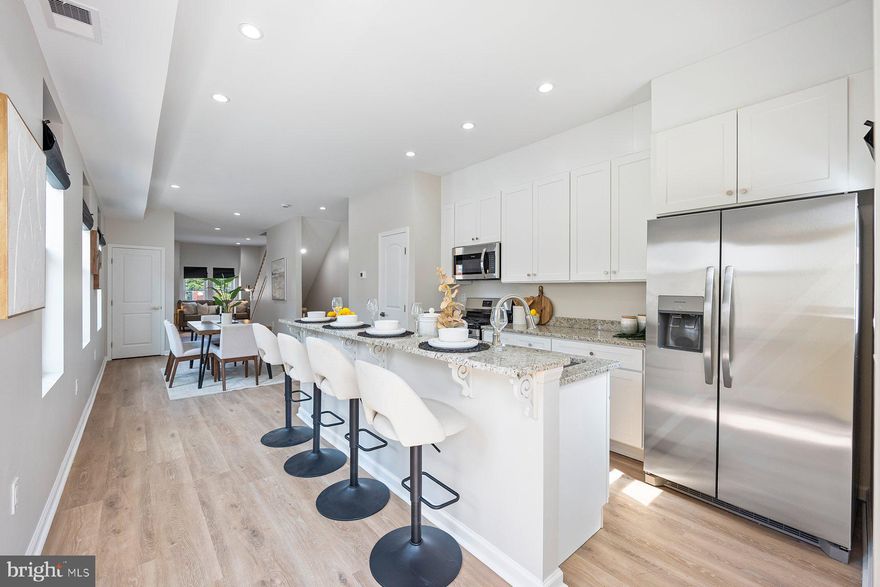 Urban Sophistication Meets Modern Comfort

Welcome to 19 N Smallwood St — a fully renovated home that blends modern luxury with unbeatable convenience. Located just minutes from downtown Baltimore, major hospitals, top universities, and with easy access to Washington, D.C., this home is ideal for professionals, students, and city lovers alike.

Step inside to a bright, open-concept layout with oversized windows that flood the space with natural light. The main level stuns with a gourmet kitchen featuring granite countertops, stainless steel appliances, and premium finishes—perfect for everyday living or entertaining. A stylish powder room adds extra convenience for guests.

Upstairs, enjoy a luxurious primary suite with a spa-inspired en suite bath, along with two additional bedrooms and a beautifully updated second full bath. The fully finished basement offers a private fourth bedroom and full bath—ideal for guests, a home office, or flex space.

You can rest easy knowing this home has been renovated from top to bottom with all permits pulled, offering peace of mind and modern efficiency throughout.

The private fenced-in patio adds a rare outdoor retreat perfect for city living.

Eligible buyers may qualify for the $10,000 Vacants to Value Booster grant—ask for details!

This one checks every box—schedule your private tour today!