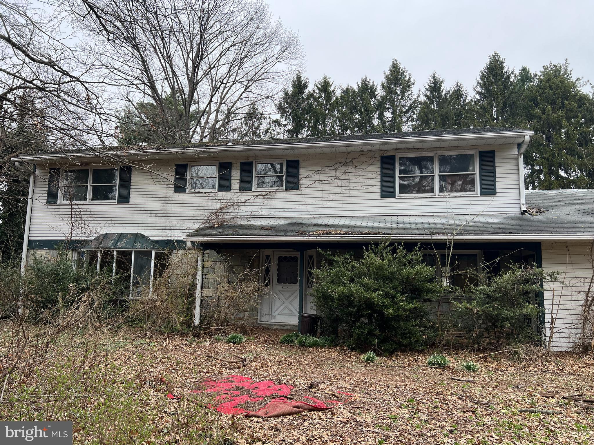 OFFER SUBMISSION DEADLINE OF WEDNESDAY, MAY 14TH 9 AM.
Bank-Owned Property with Tremendous Potential!
This spacious 5-bedroom, 3 full bath home is ready for a COMPLETE renovation — perfect for an investor or buyer with a team of skilled workers. The main level features a large family room open to the kitchen, a formal dining room, formal living room, and a sunroom that fills the space with natural light. The foyer welcomes you with a stunning curved staircase. Upstairs, the primary suite boasts a fireplace, walk-in closet, and a private balcony overlooking the backyard. Generously sized bedrooms, most with walk-in closets, provide plenty of space for family or guests. Additional highlights include a main-level laundry room with backyard access, a bedroom and full bath on the main level, a full basement and a 2-car garage. A new fence has been installed around the pool. Located off of 11-15 the nearly 1 acre lot is completely private. With its prime layout and private setting, this home offers a rare opportunity to transform it into something truly special!