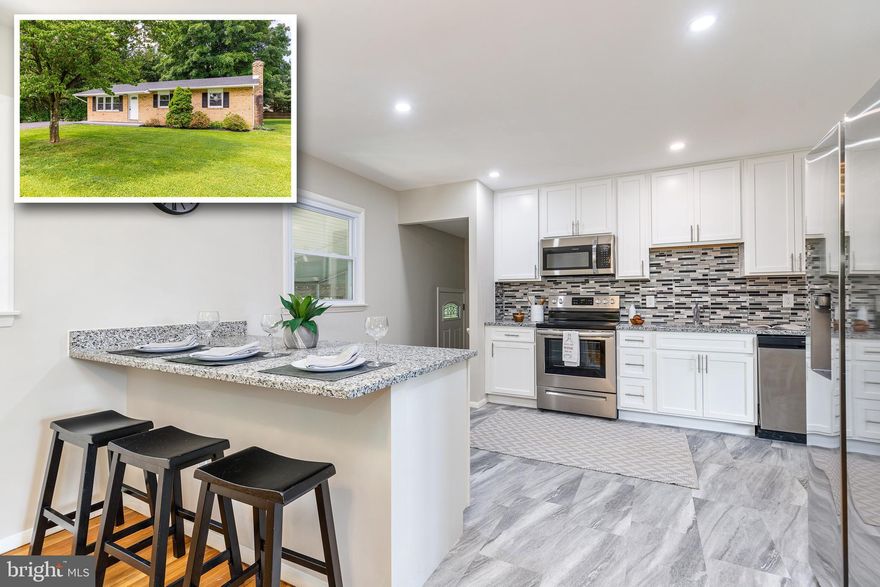 Beautifully Updated Ranch Style In Woodbine! Enter into your living area with large sun-filled windows and beautifully refinished hardwood floors that seamlessly flow through the dining room and all the bedrooms.  Enjoy an open concept kitchen/dining area that has been completely redone with custom white shaker cabinetry, granite countertops, custom tile backsplash and stainless steel appliances.  Upstairs you will find two generously sized bedrooms, a full hall bathroom and a third bedroom/master suite with full ensuite bathroom.  The basement has been partially finished and features a huge second living area with an electric fireplace.  Enjoy relaxing in your large screened in porch and large flat backyard. Parking will be a breeze with your large freshly paved driveway.  This house is ready to move right into and has so many updates including new roof, new windows, new HVAC, fresh paint throughout and so much more.  House is vacant and easy to show so schedule a showing today!