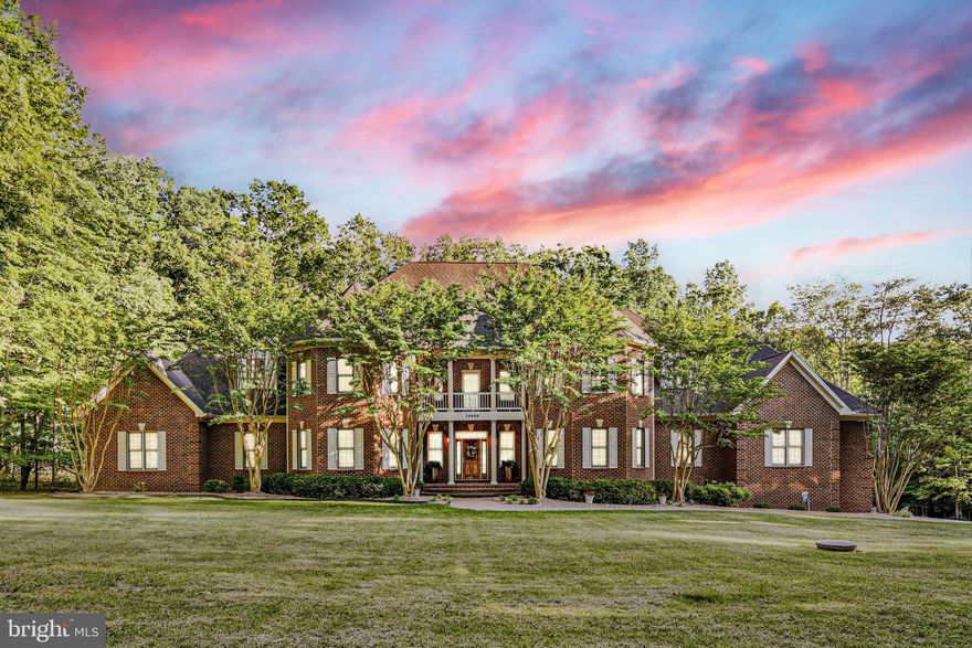 HUGE PRICE IMPROVEMENT! This multigenerational design, Rare ALL-BRICK Colonial with approx. 10,000 Sq. Ft was Designed and Built by the
Original Owner in 2004. It sits in the Sought after Community of Mineral Springs on 4.09
acres! It is surrounded by History with Walking and Hiking trails and is ideally located 10
minutes into Downtown Fredericksburg, Central Park, Shopping and Restaurants. It
Features 7 Bedrooms (1 NTC), 5 1⁄2 Baths with Attention to Detail everywhere and an
Abundance of Custom Features. The owner’s vision: “I like space and I wanted everyone to
have their own! Every room has plenty of space to enjoy themselves or come together,
whether it’s inside or outside.” He said nearly 80,000 bricks were used during its
construction! It makes a great Multi-Generational Home!” A Double Porch with Large
Southern Style Columns greets you as you approach the front! Enter the Main Living Area
with NEW White Marble floors, a See-through Gas Fireplace with Wood Mantle and Marble
Surround, 2 Story Floor to Ceiling Windows, Large Glass Chandelier with Auto Lowering
Feature for cleaning and A Light Oak and White Spindle Two-Story Balcony. To your right is
the formal Dining Room with Wide Plank Hardwood Floors, Butler's Pantry, Custom
Chandelier, and Custom Moldings. Just off the Dining Room is the Kitchen, boasting
Custom Maple Cabinets, Granite counters, High-end Stainless-Steel Wolf Appliances
(including a Sub-Zero fridge!), a high-countered island with seating and Glass Cabinetry at
each end. Off the Kitchen is the Breakfast Room that flows seamlessly into the Family
Room all with Wide Plank Hardwood Flooring and Tray Ceiling with Recessed Lighting.
There is a Second Butler's Pantry area off Family Room with mini fridge, sink, wine rack and
Custom Cabinets. Off of the Family Room is the Large Laundry Room with Cabinets and
Folding Space. A Hallway leads to the 3 Car Garage with Automatic Openers and Lighting.
Continue to the left side of the Home to the Curved Staircase Leading to the Upstairs with
Light Oak Stairs, Handrails and Plush Carpet Runner! Continue to the Main Level Primary
Bedroom with Ensuite. The Primary Bedroom includes His and Hers Closets, New
Upgraded Plank and Tile Decorative Flooring and a Large Bay Window Area! The Ensuite
includes Custom Tiled Shower with 3 Shower Heads and Glass Door, Moldings, Decorative
Columns, Double Sinks with Custom Mirrors and lots of Cabinetry on each side! There is a
Library/Sitting Room off the Primary Bedroom with Oak Shelving and Drawers on each Side
of the Stone Fireplace. Leading Up the Curved Staircase you arrive at the Upper-Level
Landing with one side overlooking the Living Room and the other leading to the Outside
Upper Porch. There are 3 Generous sized Bedrooms all with Plush Carpeting and Walk-In
Closets. There are two separate baths one is a Jack and Jill Bath which serves 2 Bedrooms
and the 3rd has a Private Bath both with Generous Cabinetry and Soaking Tubs. The Lower
level is also off the Main Entry and is an Entertainer’s dream. The Family Room includes
another Gas and Stone Surround Fireplace, Custom Plank Flooring and leads to the
outside Patio and Pool Area. ! There are 3 additional Bedrooms, 1 with Private Bath and
Door to Patio and Pool, 1 is currently being used as an office with Private Entrance and Jack
and Jill Bath with Shower for Pool Guests. The other is used as a bedroom/exercise room
and NTC. There is Custom Built Sauna which just needs some finishing touches and
Shelter Space for a future Wine Cellar! Last but not least is the Rear of Home and includes
the Cedar Plank deck with Iron Railings that stretch across the entire back with steps to
Pool area. The Saltwater Pool was added in 2017 and includes a granite waterfall feature.
Surrounding the Pool is Stamped Concrete and Custom Block Walls, Upgraded
Landscaping and a Stone Grilling Area! This Home is a Work of Art and is a definite must see to believe.