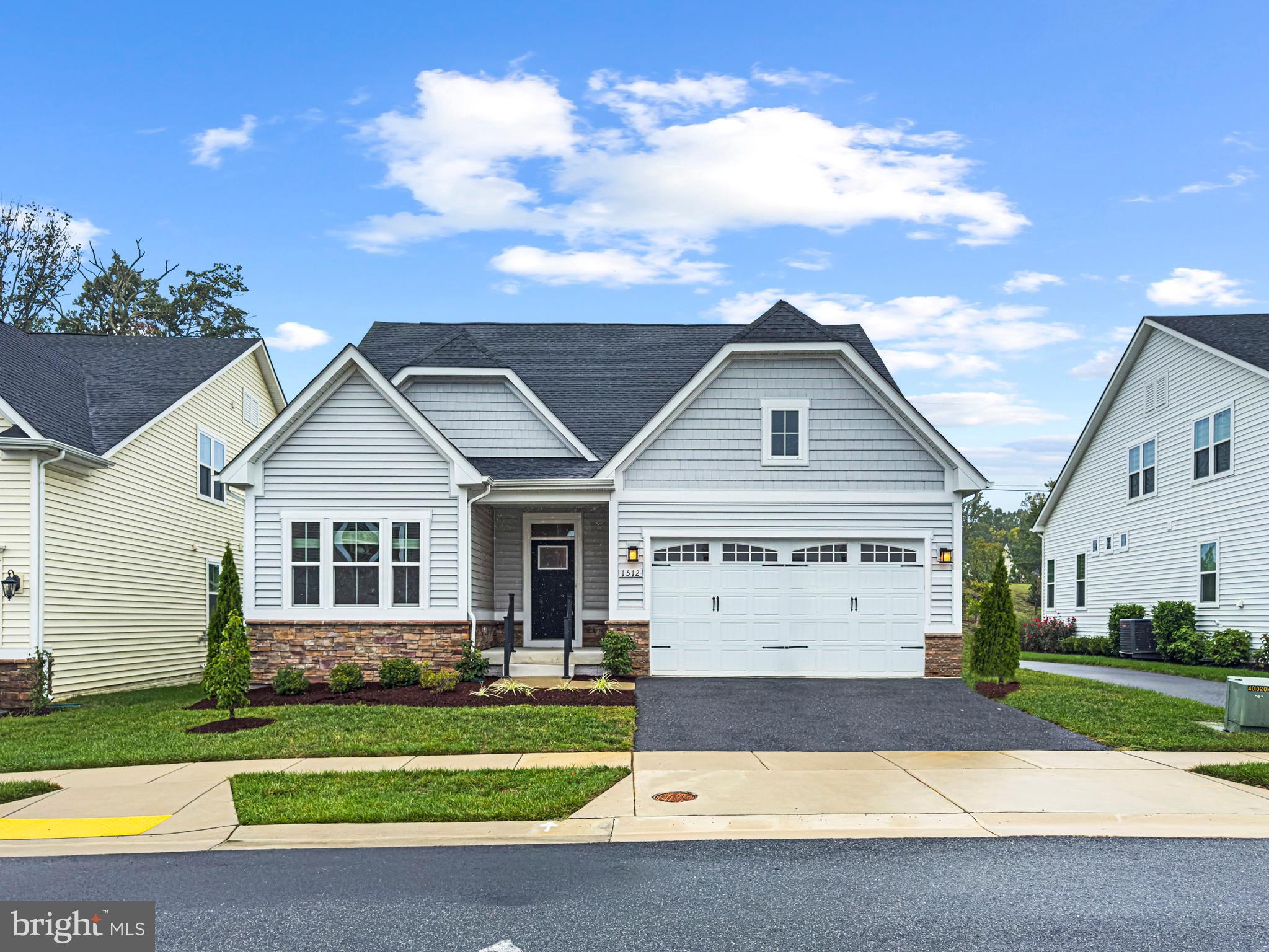 Welcome to Two Rivers, Odenton’s premier 55+ community. This inviting 3-bedroom, 2-bath home features a spacious primary suite with a large walk-in closet and a beautifully designed bathroom complete with a double walk-in shower and built-in shower seat. Neutral carpeting adds warmth to the living room and bedrooms, while the foyer, mudroom, and eat-in kitchen showcase easy-care LVP flooring. An attached 2-car garage provides everyday convenience, and the expansive unfinished basement is ready for storage or future finishing.
Life at Two Rivers comes with resort-style amenities right outside your door—indoor and outdoor pools, a fitness center, tennis and pickleball courts, walking trails, community gardens, and more. PLUS a central location near Waugh Chapel shopping, dining, and major commuter routes.