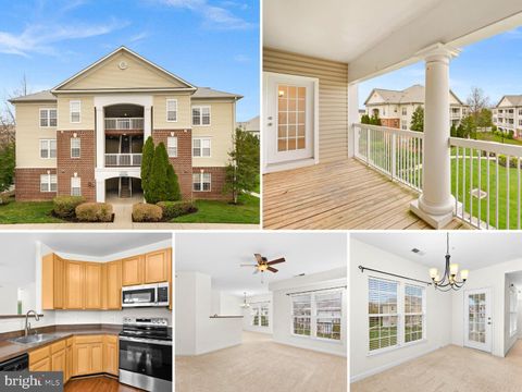 Photo of 42446 Mayflower Terrace #303, BRAMBLETON, VA 20148 (MLS # VALO2119954)