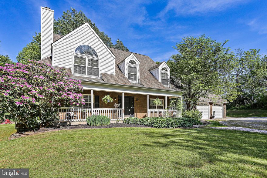 Welcome to 545 Morelock Schoolhouse Rd., this meticulously maintained Private retreat with many upgrades – can’t be missed! This 4 Bedroom, 3.5 Bath Contemporary-Colonial with Wrap around porch, and 2 Car garage sits on over 2 acres! Step into the 2-Story Foyer with an abundance of natural light, gleaming hardwood flooring and fresh paint. Begin your journey from the Bright Living Room with a cozy pellet stove & continue to the family room. Both rooms feature ceiling fans, crown molding and faux-wood plantation shutters. The Breakfast room is next, and both the family room and breakfast room feature glass doors to provide plenty of natural light and allow for family and guests entry points to the wrap around porch and rear yard. From the Breakfast room continue to the Gourmet Kitchen featuring a new Stainless-steel refrigerator, Granite counters, white cabinets, open shelving, and pantry. Next is the formal dining room (or home office) and door to the large mud room with tile flooring and access to both the rear yard and the 2 Car garage. Make your way to the Upper Level by the hardwood staircase and notice the gorgeous hardwood flooring that continues through most of the Upper Level. The Primary Bedroom ensuite features a vaulted ceiling, arched window, large walk-in closet & Primary Bath with hexagon tile flooring, step-in shower, and subway tile surround. The Upper Level also provides two additional spacious bedroom retreats with ample closet space and dormer. Another Full Bath with tile flooring, wainscoting & Tub/Shower combination provides convenience for the family. The Large Finished Lower-Level features Luxury vinyl plank flooring, a Rec Room with a movie area, game area or exercise space, Large Bedroom 4 with an attached Full Bath and jetted tub and an enormous laundry room and storage/utility room. The Walk-Out to this incredible property is also found on the lower level. The Lush & Private Rear Exterior includes a luxurious wrap-around porch, patio, dog pen, chicken coop, large level yard, New Firepit pad with 6 Adirondack-style chairs, and a RV pad with hook-up that can easily be converted to an EVS charging station. Upgrades to this home include, an RV pad, fire-pit, new septic system (2022) new refrigerator and fresh paint. This Beautiful Home can't be missed – schedule your showing today!