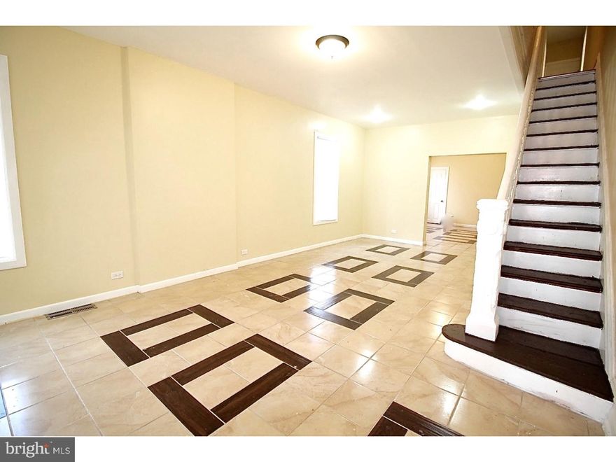 Take a tour into this fully rehabbed  corner property, not any ordinary property. Come inside this spacious living room and dinning room with modern and light colors also newer design of tiles all throughout the dinning room and living room, as you make your way into the kitchen you will see a fully renovated kitchen. This home also has 4 private bedrooms and 1  full bathroom and 1/2 bathroom located on the first floor, main bathroom as well tiled with a newer design and new concept, three private parking also available for the new owner of this house on the rear of property don't hesitate to take a tour schedule your showing.