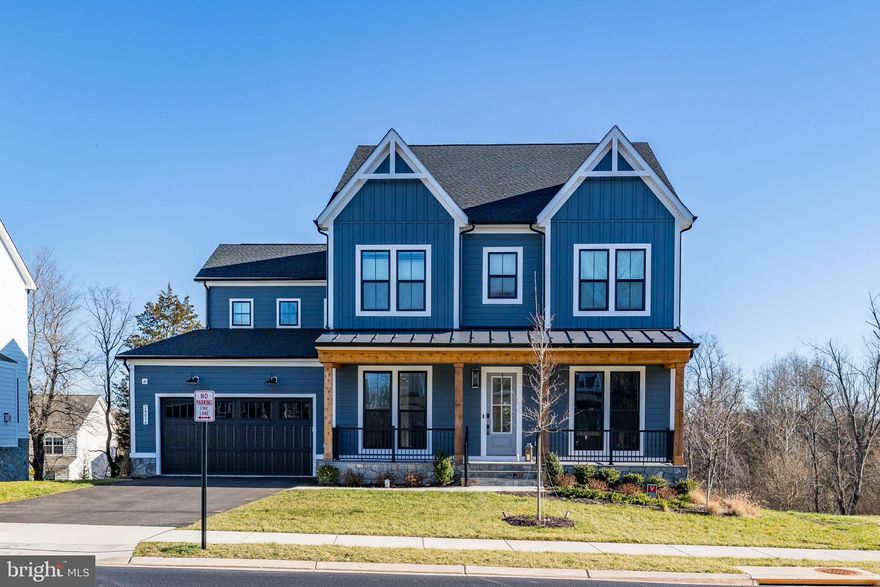 Phenomenal Hartland home just built in 2023! This 5BD/4.5BA Van Metre craftsman Belmont home features $250,000 of upgrades over 5600 sq. ft. of expansive living across 3 levels. Situated on a premium 0.2-acre lot at the end of the cul-de-sac (no home built on the left!) for added peace and privacy.

Designed with comfort and relaxation in mind, this open-concept home features a floor plan blending functionality with a modern aesthetic. Upon entering, a warm foyer welcomes you into the home with a spacious study with French doors on the right and a bright dining room on the left. Further into the heart of the home, a large extended island anchors the gourmet kitchen. Featuring upgraded cabinets with pull-out storage, quartz countertops, sleek stainless steel appliances, 5-burner gas range, double oven, upgraded air fryer oven, and deep walk-in pantry with barn door, this kitchen is every home cook’s dream. Dine in the extended morning room surrounded by lush views from the treeline or gather around the fireplace in the living room. A bonus second home office and half bathroom complete the main-level. Access the elevated trex deck via the great room, great for summer BBQs and outdoor gatherings. Stairs provide access to the backyard.

Upstairs, the deluxe primary suite includes 2 extensive dual walk-in closets and an extended sitting area bathed in natural light. Soak away your stress in the dramatic stand-alone tub or wash away the day in the oversized shower with a built-in seat in this spa-like en suite. Two standalone vanities frame the tub. Separate water closet for extra privacy. Two additional bedrooms upstairs share a full bath with dual vanity, while the final bedroom features an en suite bathroom, great for guests! A laundry room and convenient linen closet complete the upper level. 

On the lower level, a spacious finished basement with an add-on extension provides a large canvas to create the recreation/entertainment/fitness space of your dreams! The finished basement also includes a bedroom with full bathroom, a built-in wet bar, and walk out to the backyard. An unfinished room primes the lower level for an additional 6th bedroom with hook-up for an en-suite bathroom.  An additional washer/dryer hook-up available in the utility room. 

Extra upgrades include a full house water filtration system, home security system, and wide plank LVP throughout the main and upper levels with upgraded carpet in the finished basement. A large attached 2-car garage provides extra storage space and dedicated home EV charger.

Numerous neighborhood amenities include a modern clubhouse, community center, state-of-the-art fitness center, resort-style outdoor pool, playground, basketball/tennis courts, and miles of walking paths. Zoned for highly ranked Loudoun County schools! Countless grocery (Harris Teeter, Walmart Super Center), shopping, dining (5 min drive to Old Farm Winery), and entertainment options. Convenient commuter location with easy access to US-50 and Dulles Airport (20 min drive). 50 minutes to downtown DC. Make Hartland your home today!