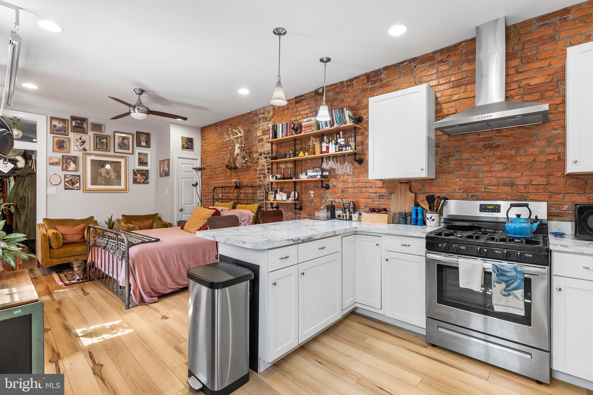 Available Nov. 1st. The important details: Laundry, private entrance, dishwasher, big kitchen, private patio, heat included, exposed brick and bedroom that fits a queen-sized bed. Bring your own A/C window units—this unit does not have central air. Designed with an industrial feel of exposed brick and high ceilings with warm and homey touches of wide plank floors, recessed lighting and classic radiator heat (included in rent). Spacious cook's kitchen with brand new stainless steel Frigidaire appliances and breakfast counter for 3 stools. Private 150 sq. ft. back patio. No bedroom closet but space for you to add a wardrobe. Tenant pays only electric and internet/cable. Great Fishtown location: steps from Meetinghouse Pub and a short walk to Riverwards Produce, Loco Pez, Circles and Squares Pizzeria, and Philadelphia Brewing Co. Just 15 minutes to Berks Station on the Market-Frankford El. One cat may be considered with refundable pet deposit. To apply: $50 credit/background check, proof of income, landlord reference, and valid ID.