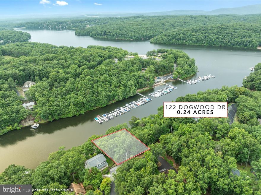 Come build your lake cottage on this waterfront lot in Lake Holiday! This lot is located across from the marina on a wide finger of the lake in a no wake zone, yet close to all of the action. Add a dock for private boat parking - and take advantage of all of the amenities Lake Holiday has to offer including 3 beaches, hiking trails, clubhouse, exercise room, sports courts, dog park, 18 hole disc golf course, and more! Water/sewer connection is only $5k, and homes must be at least 1,000 SF, modular and stick built homes are allowed! No trailers, campers, or manufactured homes are allowed. Lots may NOT be camped on as this is a developed community, but there is no timeline to build!