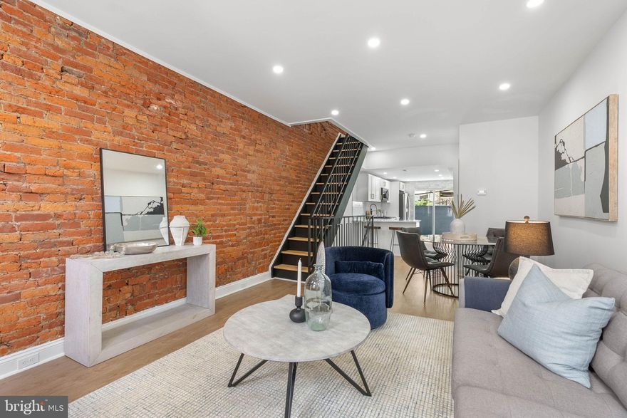 Welcome to your dream home in Melrose in South Philly! This fully renovated 2-bedroom, 1.5-bath beauty with a finished basement has been transformed from top to bottom, blending modern design with timeless charm. Step inside to discover wide-open living and dining areas highlighted by a dramatic exposed brick wall and new vinyl flooring throughout. The chef’s kitchen is a showstopper, complete with bar seating, brand-new stainless steel appliances, white shaker cabinets, glass subway tile backsplash, under-cabinet lighting, and ample prep space. A sliding glass door fills the room with natural light and opens directly to your private backyard oasis, the perfect canvas for gardening, barbecues, and entertaining. A chic new half bath with designer tile completes the first floor. Downstairs, the finished basement offers generous ceiling height with endless possibilities such as a home office, gym, playroom, or media room. Upstairs, you’ll find two bedrooms, including a spacious primary bedroom with two large closets, plus a full bath featuring a sleek tiled shower, bespoke vanity, and modern finishes. Every detail has been thoughtfully updated with all new systems including the roof, HVAC, plumbing, electrical, and hot water heater for total peace of mind. Enjoy the convenience of Holy Cannoli Café at the top of the block, and just a few minutes walk to some of South Philly’s favorite spots like Tap Room on 19th, Heavy Metal Sausage, Stina, Café y Chocolate, and Café Nhan. The location can’t be beat with easy access to I-95 and 676, public transportation, and the stadium district just steps away.  This stunner checks every box. Schedule your showing today!