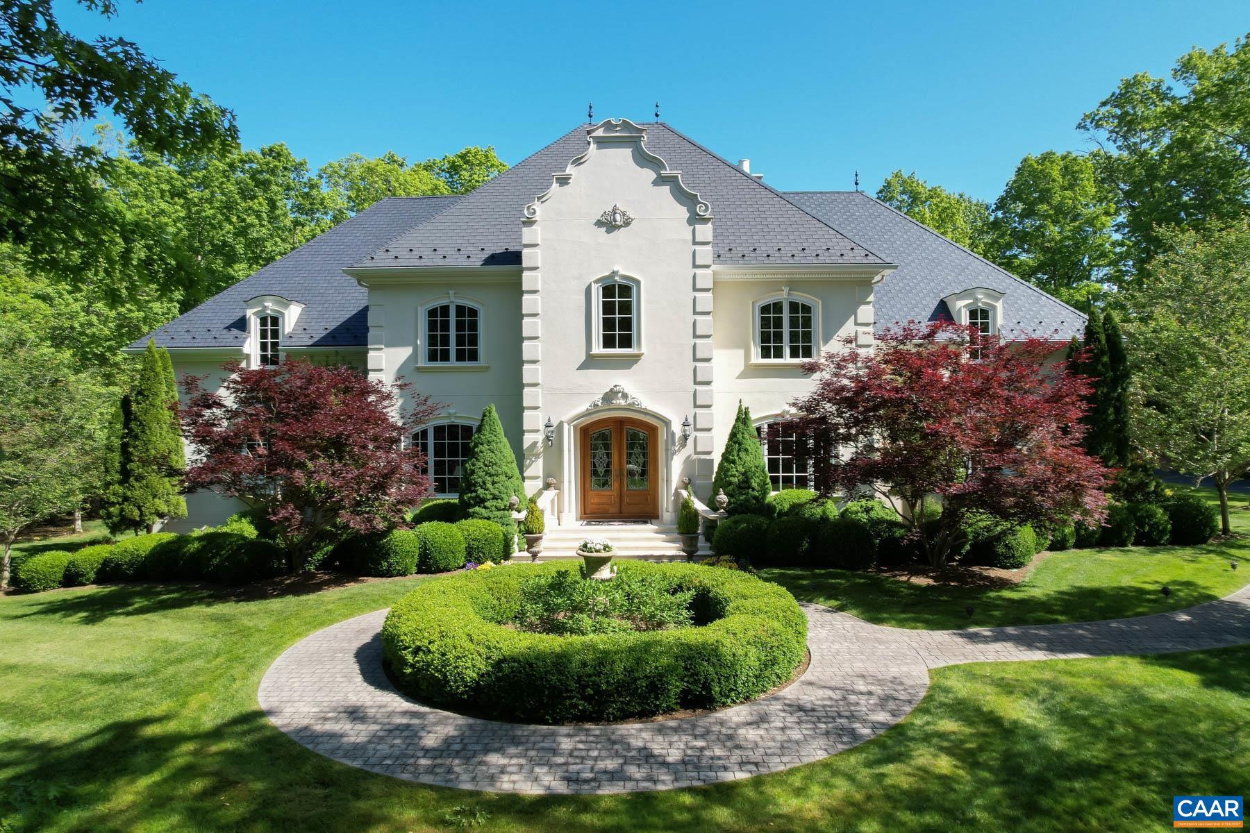 Classic Elegance in Keswick Estate. Adjacent Renowned Country Resort Keswick Hall, described by Garden & Gun Magazine as one of the best Southern Retreats, includes expanded accommodations, infinity pool & cabanas, championship 18-hole golf course, Marigold Restaurant helmed by acclaimed Chef Jean-Georges Vongerichten, & much more. Amongst this Virginia Oasis lies one of the most meticulously well-built homes you will find. Constructed by Baird Snyder, the French Normandy style home sits on a 2.7 acre corner wooded lot. Composite slate roofing, turrets and copper finials, egg and dart crown moldings. 20' high sweeping entry with leaded beveled glass front doors leading to the limestone foyer with curved staircase sets the tone for this exciting home created for entertaining and daily living. Light filled, comfortable rooms thoughtfully planned with arched windows and doors. Endlessly stunning features for the most discerning of buyers include custom door design, carved white statuary marble fireplace mantel, cast stone work on the exterior and solid mahogany arches, & extensive gardens and terraces. 3,000 s.f. of unfinished space for you to customize. Fiber Optic internet. Close to Charlottesville, D.C., and Richmond.,Granite Counter,Maple Cabinets,Fireplace in Family Room,Fireplace in Living Room,Fireplace in Study/Library
