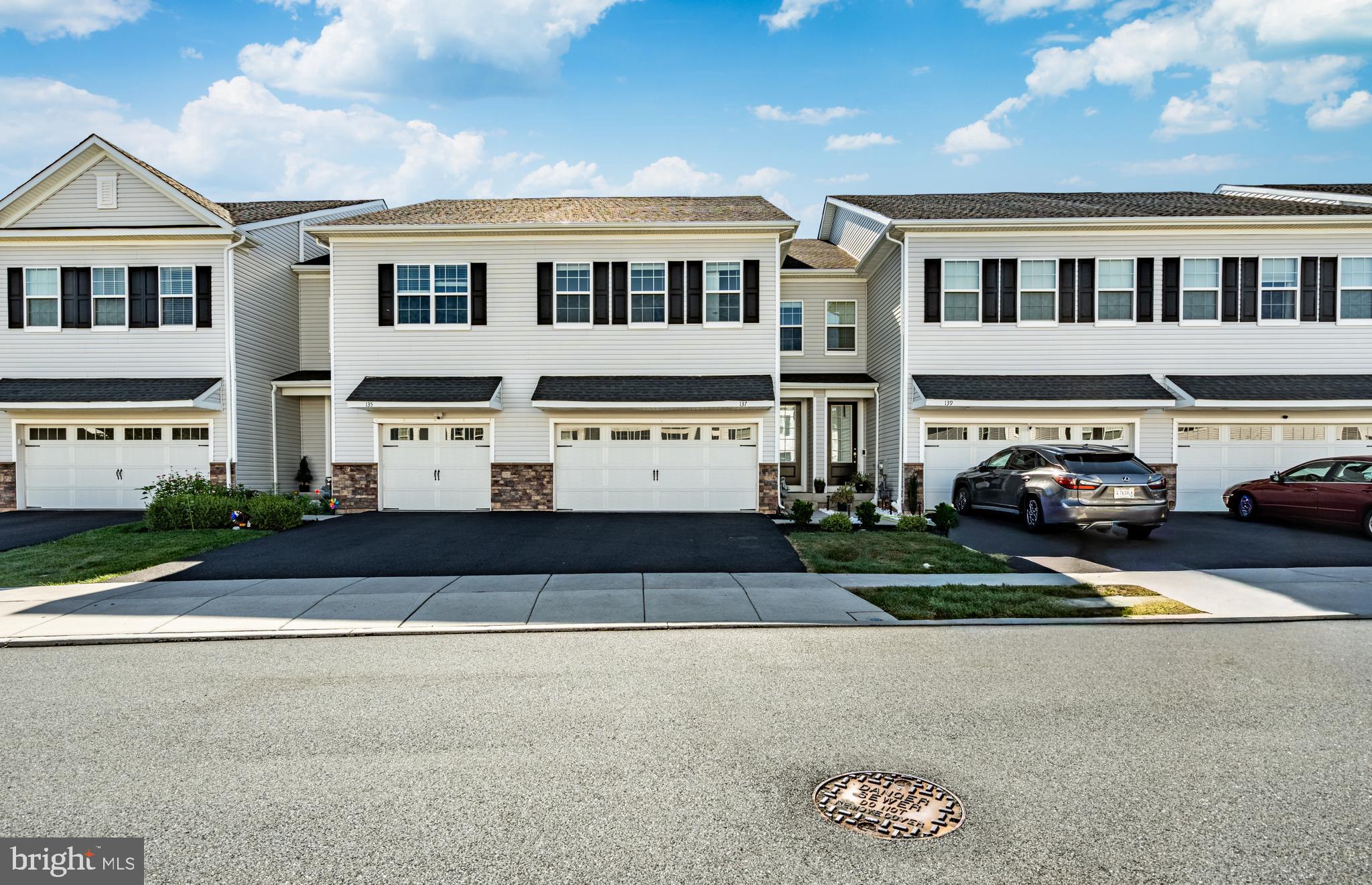 Welcome to 137 Knock Hill Drive, a freshly painted, 6-year-young Annabelle model home that beautifully combines luxury, comfort, and thoughtful upgrades—truly better than new construction, and move-in ready without the wait. Located in the desirable Southall community in Limerick Township, this meticulously maintained home offers the perfect blend of modern finishes, flexible living spaces, and premium features that today’s buyers crave. From the moment you step inside, you’re greeted by gorgeous hardwood floors throughout the entire first floor, setting a tone of warmth and sophistication. The open-concept layout is flooded with natural light and designed for seamless everyday living and entertaining. The heart of the home is the gourmet kitchen, showcasing stainless steel appliances, elegant cabinetry, granite countertops, and an oversized island that doubles as both a prep space and stylish gathering spot. The kitchen flows effortlessly into the expansive great room, where double sliding doors lead out to a spacious Trex deck overlooking a private wooded backyard—ideal for entertaining or simply unwinding in peace. Upstairs, you’ll find a flexible loft area perfect for a home office, study zone or reading nook. The luxurious primary suite offers a serene escape with a large walk-in closet and spa-like en-suite bathroom featuring frameless glass shower doors, double vanity, and a private water closet. Two additional bedrooms—each with their own walk-in closets—share a spacious hall bath, while the convenient second-floor laundry room adds everyday ease. The finished basement expands your living space even further, offering a versatile area for a playroom, gym, guest suite or home office, complete with a full bath. A major bonus is the attached two-car garage equipped with an electric vehicle charging station—a valuable feature for eco-conscious buyers and future-focused homeowners. With two additional driveway spaces, parking and storage are never a concern. This home is ideally located just minutes from Route 422, the Philadelphia Premium Outlets, local shopping, dining and more. You're also just a short walk from Manderach Memorial Playground and Limerick Community Park offering walking trails, multiple sports fields, tennis courts, basketball courts, volleyball courts, soccer fields and newly installed pickleball courts. And don't forget this home is located in Spring-Ford school district. So, why wait for new construction when this upgraded, turn-key home is ready now? 137 Knock Hill Drive offers the space, style and location you’ve been searching for—schedule your private showing today and see for yourself what makes this home truly special. And to top it all off, the new homeowner will receive a 1-year America's Preferred Home Warranty—peace of mind included. Schedule your private tour today!