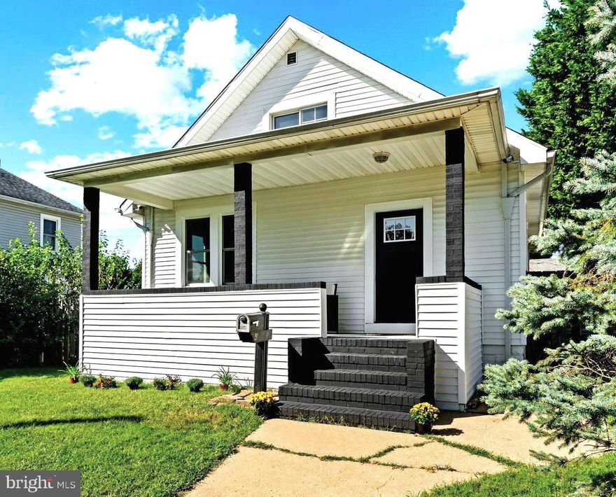 Under contract with contingency. Show for "backup offers" Only . Single-Family home with Garage, fully fenced in yard, and fabulous one-level living. No HOA fees to worry about, just enjoy your own private urban oasis.  Have every amenity on the main level!  You can walk to the grocery store, restaurants and public transportation. This property is located in the beautiful established neighborhood of Old Brooklyn Park WEST in Anne Arundel County. Offering a welcoming covered front porch. Towering 9-foot ceilings on main level. Enjoy two convenient main level bedrooms, and 2 loft upstairs spare bedrooms (great for a studio or home office). Attractive new flooring and paint throughout. *New* Central Air conditioning. Stunning gourmet Chef's kitchen. Featuring premium quartz counters, backsplash, quality 42inch soft self-close cabinets, farm style sink, NEW Cosmo stainless microwave drawer, extravagant custom rangehood, high-end Cosmo luxury stainless steel appliances, built-in refuse/ recycling cabinet, and large walk-in pantry. *New windows*. Contemporary ceramic tile in kitchen and bathroom. Stylish walk-in shower with alcove seating, modern vanity and fixtures. Large main level laundry room, LG front load washer/dryer(s) and delightful rear deck with steps down. Tall private fenced in yard and Oversized GARAGE with loft space with water/ electric with exclusive alley access. Full unfinished basement. Only 20 min from Ft Meade (295), 15min from BWI, 25 min from Annapolis (97),  20 min from Severna Park/ Arnold. (rt 10)