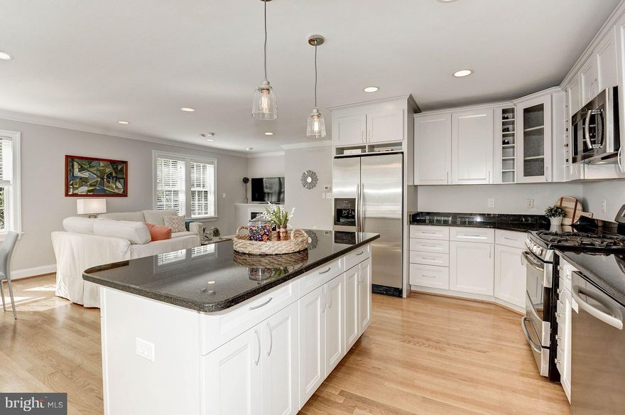 Mins to Crystal City & Clarendon-  Farm House built in 2004, with 5 bedrooms, 4.5 baths, sweeping front porch, rich hardwoods on main & 2nd level, modern kitchen open to family room, & large deck over looking flat and fenced backyard. 4 bedrooms ups and a separate lower level apartment with full kitchen and W/D. *Permitted lower level apartment w/Kitchen& W/D! Walk-able to Clarendon, Metro, & Parks.