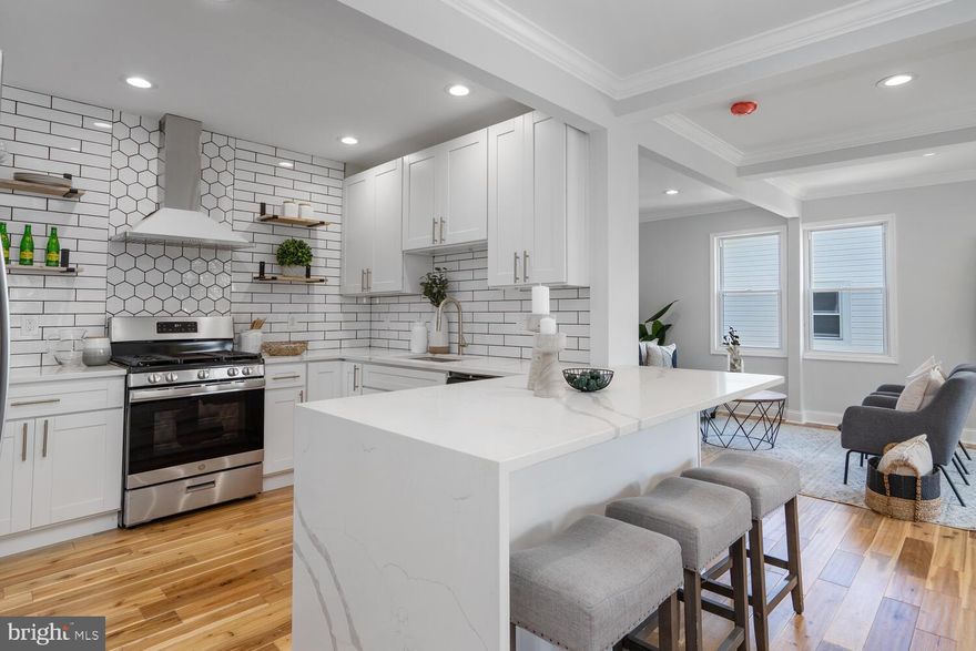 READY FOR YOU! Charming, open floor plan featuring a gourmet kitchen with stainless steel appliances and quartz counters; 2 full bathrooms with custom tile throughout; gleaming hardwood floors on the main level plus all new wall to wall carpeting in the lower level; Recessed lighting throughout and a large level yard
and off street parking on a private driveway. COME SEE IT TODAY!