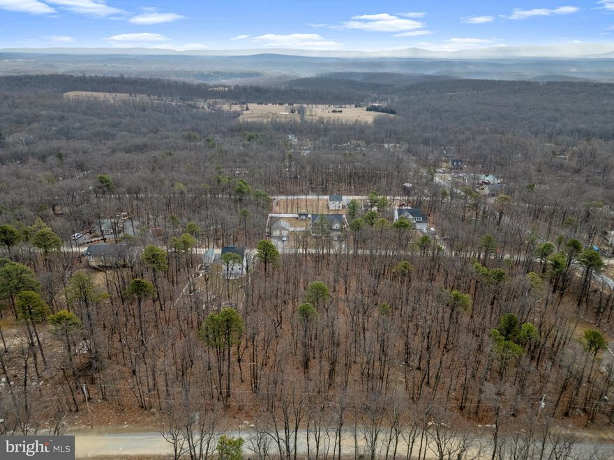 Affordable lot in Wilde Acres / Mountain Falls Park in Winchester, VA! This 0.26-acre lot is ready for your imagination — build a weekend getaway, future home, or simply enjoy your own slice of nature. Surrounded by beautiful mountain and wooded views, this peaceful lot offers the perfect retreat while still being just a short drive to downtown Winchester. New construction is happening throughout the area — get in now before prices keep rising! With low taxes, community road access, and great value, this is an excellent opportunity to own land in Winchester, Virginia.