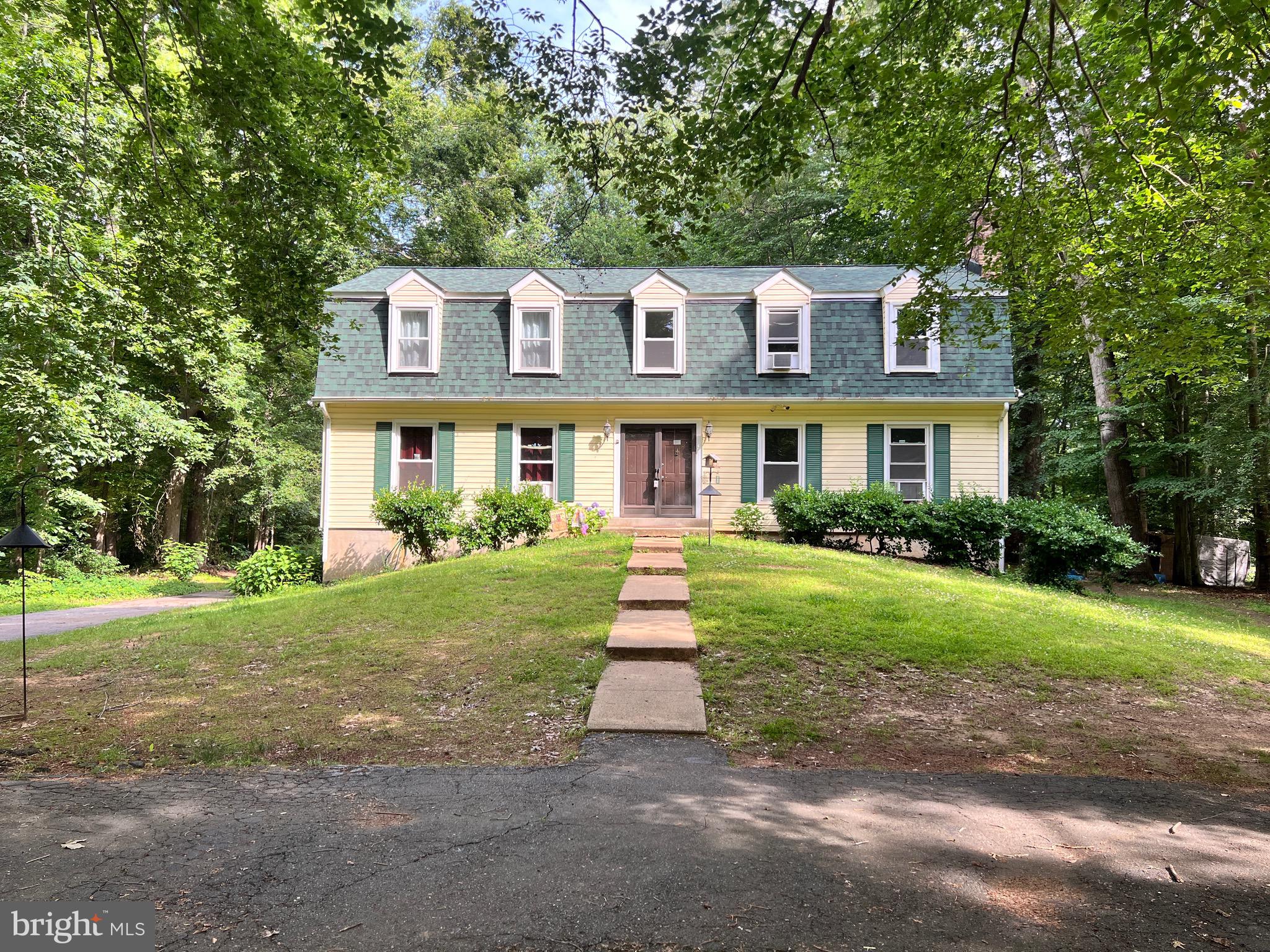 New roof (replaced January 2025), fresh paint and new carpets (main and upper floor), no HOA, located directly across from Chapman State Park (borders the Potomac River and features fishing, hunting, and hiking trails), situated on 1.69 acres of wooded privacy.
This spacious home includes 4 bedrooms and 4 full bathrooms (two on the upper level, one on the main level, and one on the lower level). A section of the basement is partially finished with a second kitchen, full bath, laundry area, and ample storage space.