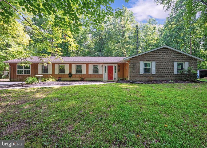 Discover absolute privacy and relax in one level living in this 4-bedroom, 2-bath home located in Northern Calvert County minutes from Chesapeake Beach. Nestled in a quiet cul-de-sac, this ranch style home offers a blend of comfort and space on the interior enhanced by an outdoor oasis with an in-ground pool, paved deck, and fencing. Inside you will find a living room, large great room, dining room, kitchen, hall bath, and laundry room.  Four spacious bedrooms offer peacefulness and privacy. Large primary bedroom boasts an en-suite bathroom. Get cozy in front of your fireplace with pellet stove insert or cool off in your pool. Ample storage available with 2 outdoor sheds and a container. The home built in 1977 offers opportunity for additional updates to modernize and customize for your lifestyle. No HOA. Bathrooms, flooring, and lighting were redone in the past couple years. A new septic system was installed in 2021 and the roof was replaced in 2022. Seller is offering a 1 year home warranty. Close proximity to Chesapeake Bay and Patuxent River. Easy commute to Annapolis, Washington, D.C., Andrews AFB, Baltimore and Virginia. Take advantage of updated pricing.