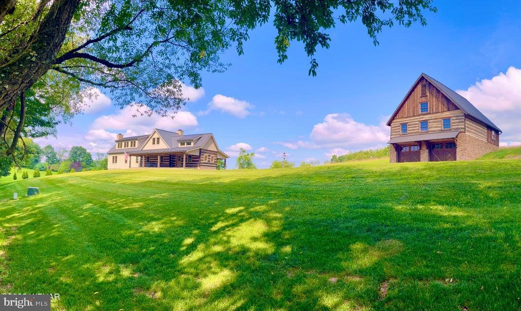 Step back in time to this original 1780's Pioneer home, one of the first Pioneer log homes built in Lycoming County. This beautifully crafted custom stone and log home is a dream come true! This home was painstakingly dismantled, preserved and reconstructed to create this historic treasure. Own a piece of history, with all the modern conveniences of today. No expense was spared to create this 3755 square foot home; a perfect blend of period correct construction and top of the line amenities, such as the matching suite of Zline kitchen appliances, Kraftmaid kitchen cabinetry and handsome soap stone countertops as well as the beautifully designed and crafted bathrooms, top of the line Anderson windows, and so much more. Please see the list of details and features in documents!