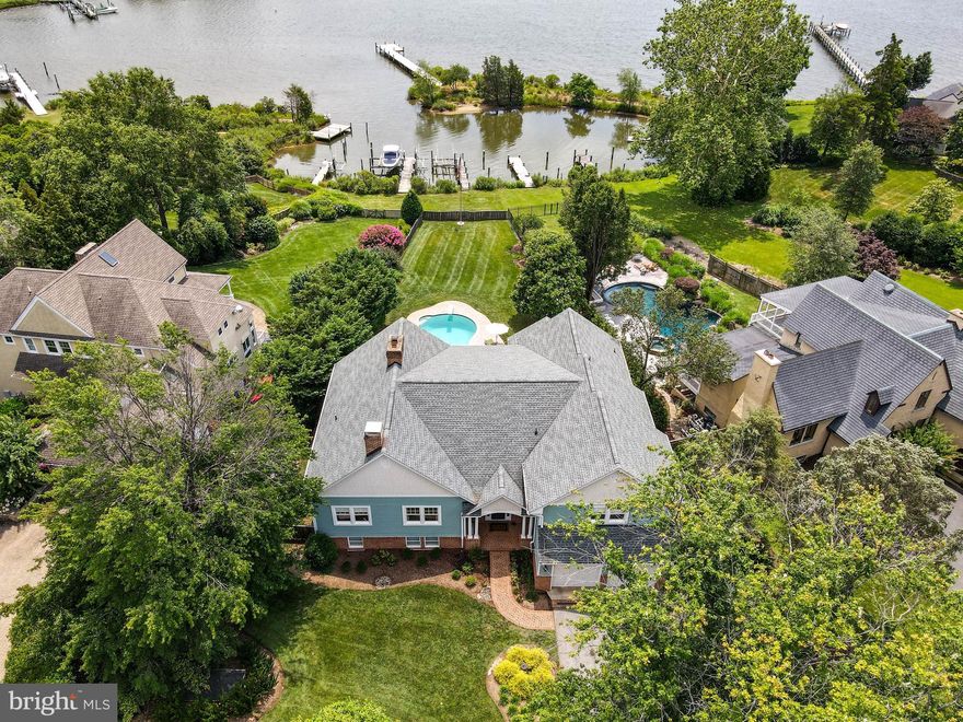 Location, Location, Location!  Stunning South River waterfront in the sought after community of Wild Road Shores!  This neighborhood is a historic peninsula of private homes providing water access to all residents and is conveniently located just a few minutes to downtown Annapolis and all major travel routes.  This home has everything your most discerning buyers are looking for... a spacious open floor plan with waterviews from most of the rooms, a screened in porch just off the kitchen, a waterside pool with plenty of patio space and a private dock with boat lifts on a protected cove.  With 5 bedrooms, 5 1/2 baths and features including new hardwood flooring throughout the main level,  a waterside primary suite, separate dining room, home office, and lower level recreation room, this home provides space for both work and play.  Easily entertain guests or vacation at home in your own backyard! Community amenities include a boat ramp, waterfront park with pavilion and tot lot. HOA is voluntary and  only $150 a year. Tax records do not provide accurate square footage...please see floor plans for more detail.