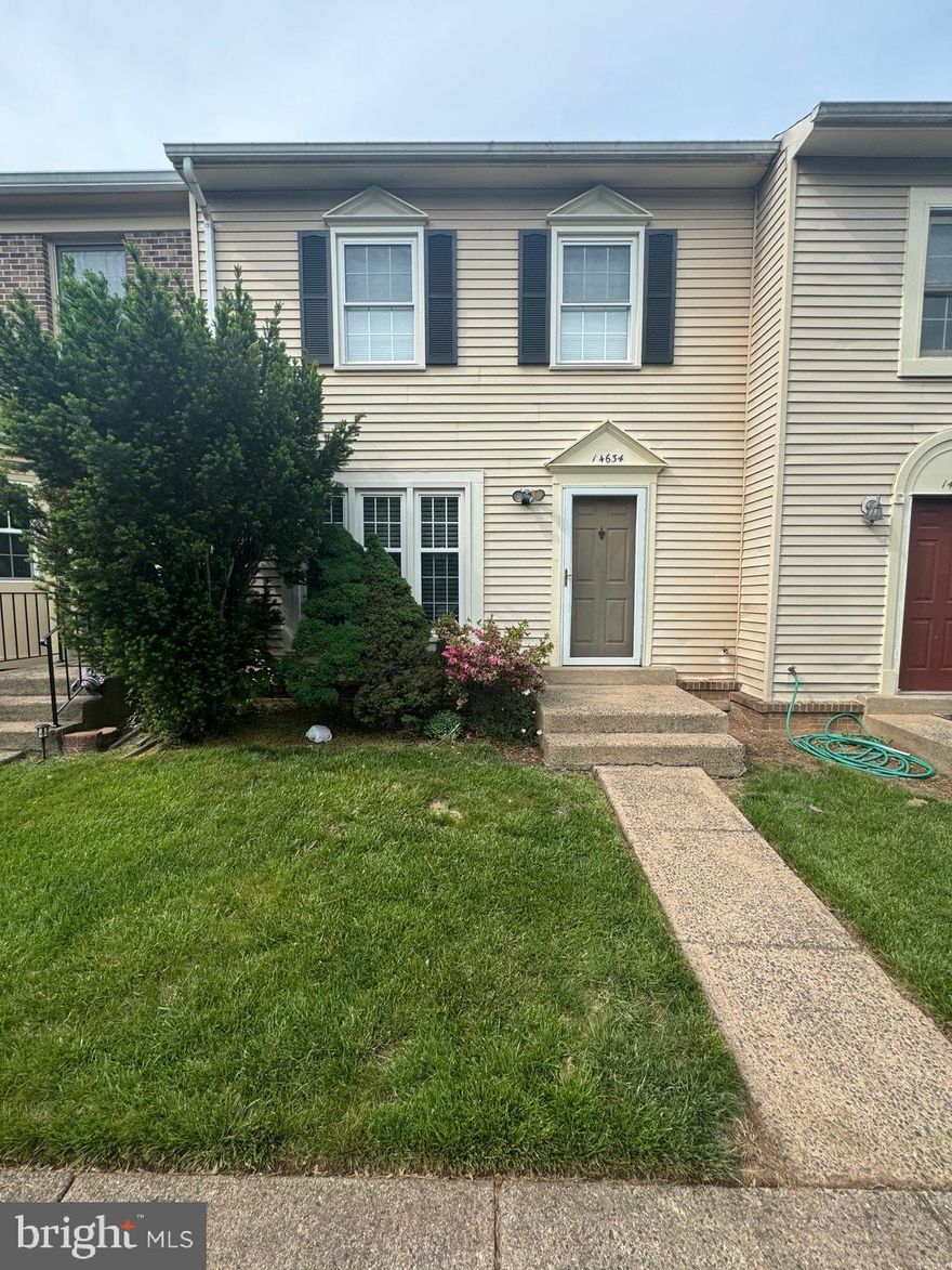 *COMING SOON* Available May 7th - Pets strictly case-by-case basis contact listing agent for approval -Tucked away on a quiet cul-de-sac and backing to serene woodlands, this beautifully maintained three-level townhome offers the perfect blend of privacy, space, and style. Featuring 3 bedrooms, 3.5 baths, and two assigned parking spaces, this light-filled home welcomes you with rich hardwood floors and designer neutral paint throughout.

An open foyer leads into the spacious living room, where recessed lighting and triple windows bathe the space in natural light. The adjoining kitchen and dining area are a true highlight, showcasing abundant white cabinetry, stainless steel appliances—including a smooth-top range—and a contemporary glass-shaded chandelier. Sliding glass doors open to a private deck overlooking lush trees, ideal for entertaining or dining al fresco. A stylish powder room completes the main level.

Upstairs, the hardwood floors continue throughout, including in the impressive primary suite with vaulted ceilings, dual closets, and a well-appointed en-suite bath. Two additional sunlit bedrooms share a full hall bath, offering comfort for family or guests.

The walk-out lower level provides exceptional flexibility with a large family room—perfect for media, fitness, or relaxing—as well as a versatile bonus room/den, full bath with step-in shower, and a convenient laundry area with front-loading machines.

All this in a tranquil yet highly convenient location—just moments from Village Center shops, dining, and grocery stores, with easy access to Braddock Road, I-66, and Route 28. Outdoor lovers will appreciate nearby Stone Crossing Park and scenic Cub Run Stream Valley Park, featuring miles of nature trails.