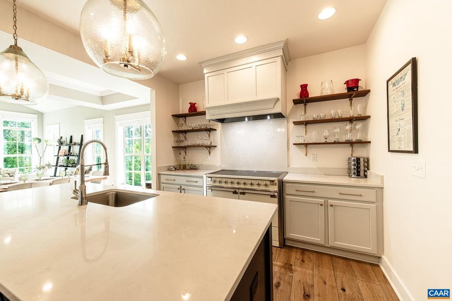 Discover this nearly-new, luxury home built in 2022 by Craig Builders, offering top-tier finishes and custom upgrades. Boasting an open floor plan, wide hardwoods, and two offices, the stunning kitchen features quartz counters, a 48" AGA induction range, and custom hood, flowing into a bright great room with cathedral ceilings and protected woods views. The owner's suite includes a spa-like bath with Carrera marble and towel warmer. Upstairs are a spacious loft, two bedrooms, and ample storage. The finished terrace level offers a versatile great room, a guest suite, and a shaded patio?perfect for entertaining. The whole-house generator leaves you protected from outages too! Located in Old Trail, walking distance to shops, dining, trails, and just a short drive to wineries and breweries. An ideal move-in ready home for the discerning buyer seeking elegance, comfort, and location.,Fireplace in Great Room