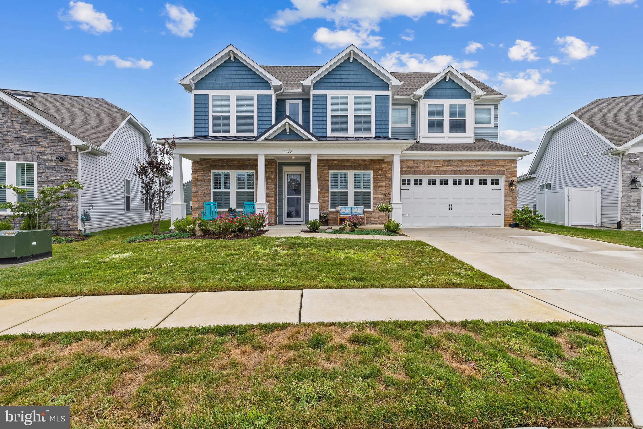 Welcome to 132 Kestrel Lane, an exceptional home in the premier waterfront community of Four Seasons at Kent Island. Offering over 3,600 square feet of thoughtfully designed living space, this residence combines elegant design, modern functionality, and a lifestyle centered around comfort, connection, and the natural beauty of the Chesapeake Bay.
From the moment you arrive, the covered front porch and charming curb appeal set the tone for what awaits inside. The grand two-story foyer opens to soaring ceilings, wide plank wood flooring, and light-filled spaces dressed in timeless plantation shutters. The main level is designed for easy living, with 10-foot ceilings that create a sense of openness and flow. At the heart of the home, the great room features cathedral ceilings, crown molding, and a gas fireplace, providing a warm gathering place for both intimate evenings and lively entertaining.
The designer kitchen blends beauty and function with a large island, stainless steel appliances, a gas range, backlit cabinetry, and a beautifully lit backsplash that adds a touch of sophistication. The open-concept design extends into the breakfast area, making mornings and casual meals a delight. A screened-in porch and fenced patio create a seamless transition from indoor living to outdoor enjoyment, perfect for entertaining or simply savoring quiet moments surrounded by nature.
The first-floor primary suite is a true retreat, complete with a spacious walk-in closet outfitted with built-ins and a spa-inspired bath designed with relaxation in mind. A second bedroom with its own private bathroom on the main level offers comfort and privacy for family or overnight guests, while a dedicated office provides the flexibility to work from home with ease. The convenience of a mudroom with built-ins and a first-floor laundry adds to the thoughtful design of this home.
Upstairs, a large loft-style living area can serve as a media or game room, offering additional space for recreation, relaxation, or hobbies, while two generously sized bedrooms share a well-appointed bathroom. A large two-car garage with an extra storage and workshop area provides ample space for all your needs—including the perfect spot to store multiple kayaks. Every detail of this home has been carefully curated, from the crown molding to the custom finishes, creating a space that feels both refined and welcoming.
Beyond the home itself, life at Four Seasons at Kent Island offers an unparalleled resort-style experience. Residents enjoy exclusive access to the Chester House Clubhouse, where a ballroom, bar and lounge, gathering spaces, and a demonstration kitchen set the stage for community and celebration. Fitness and wellness are at the forefront with indoor and outdoor pools, a state-of-the-art fitness center, yoga room, and walking paths. Outdoor amenities abound, from tennis, pickleball, and bocce courts to a kayak launch, fishing pier, and dog park. Evenings can be spent at the fire pit, tiki bar, or amphitheater, creating countless opportunities to connect with neighbors and enjoy the Chesapeake lifestyle.
Perfectly situated on Kent Island, this home is more than just a place to live—it’s a way of life. Here, every day feels like a retreat, with the Chesapeake Bay as your backdrop and a vibrant community at your doorstep. Welcome to 132 Kestrel Lane, where luxury, comfort, and lifestyle meet.