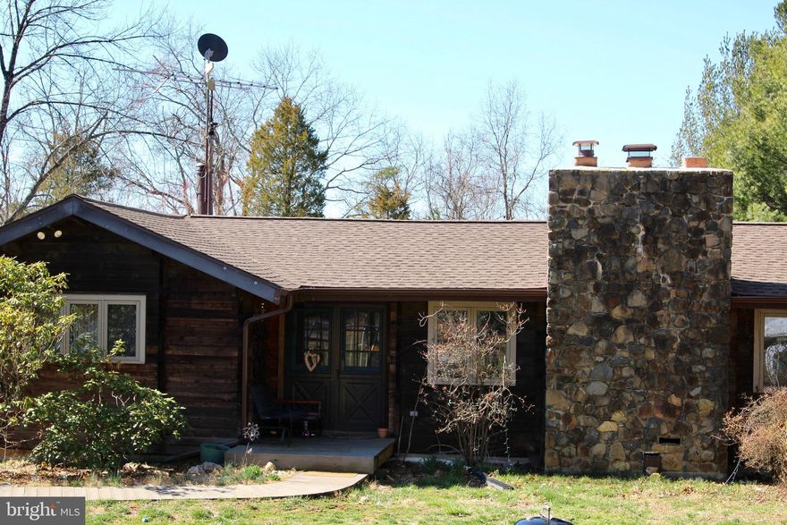 Incredible wood work on this Log style Raised Rancher in the heart of Aldie on almost 2 acres.  Two huge living spaces, one on each level.   Two level wood burning fireplace.  Walk out to deck on main level and look at the amazing views.   Brand new roof, gazebo with electricity.   Lot is large enough to build a second home.  No HOA!!!    Kitchen has butlers pantry with lots of storage.  Master and two additional bedrooms on the main level along with Master bath and 2nd bath.  Lower level has great storage and an additional living area bedroom and bathroom which could be rented out.   Newer HVAC and water heater.  Walking distance to 50 West and Chrysalis wineries.   Two car over-sized garage and long driveway can fit many cars!!!!