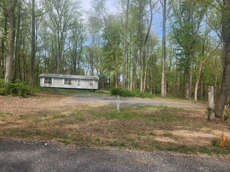 Welcome to Lot 3 on Mullins Court in Rising Sun!  Come build your dream home on this beautiful 1.63 acre building lot on a private court with only 1 other lot available!  The property has been perced  and the lot is cleared with the driveway in  place.  Seller has also had the electric brought in!  Currently there is a double-wide on the property which the seller will leave (thru a private sale of $10,000) if desired or he will have it removed.   Lot 4 is also available for sale separately so it would be a great opportunity for multiple families to come together!  Come see this gorgeous peaceful setting and make Mullins Court in Rising Sun your new piece of paradise!  No Builder Tie-In!