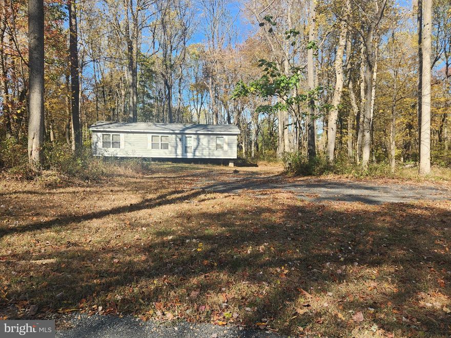 Welcome to Lot 3 on Mullins Court in Rising Sun!  Come build your dream home on this beautiful 1.63 acre building lot on a private court with only 1 other lot available!  The property has been perced  and the lot is cleared with the driveway in  place.  Seller has also had the electric brought in!  Currently there is a double-wide on the property which the seller will leave (thru a private sale of $10,000) if desired or he will have it removed.   Lot 4 is also available for sale separately so it would be a great opportunity for multiple families to come together!  Come see this gorgeous peaceful setting and make Mullins Court in Rising Sun your new piece of paradise!  No Builder Tie-In!