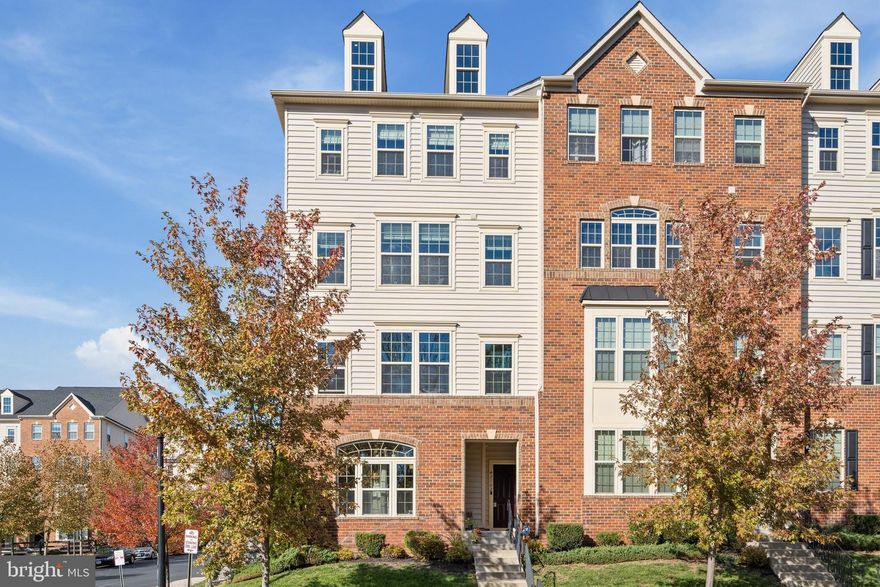Straight out of a magazine and ready to call yours, this stunning end unit 1-car garaged townhome style condo is the gem of sought after Virginia Manor in Aldie!  The open floor plan features elegant and modern fixtures/finishes throughout, upgraded wide plank hardwood floors, whole home sprinkler system for peace of mind, lots of recessed lighting, crown molding, and a designer color palette ready for your personal touches. The bright and airy kitchen is a chef’s/entertainer’s dream with plenty of sleek cabinets, granite countertops, stainless steel appliances, oversized kitchen island with breakfast bar, beautiful pendant lights, backsplash, and an eat-in area plus a large sitting area ready for game night or a cozy night in. On the upper level, you’ll find 3 generously sized bedrooms to include the well-appointed primary bedroom with a tray ceiling, en suite bath boasting upgraded dual vanities and two walk-in closets. Upper level laundry room with folding area/cabinets provides added convenience!  Let your worries fade into the sunsets while enjoying your private covered balcony overlooking an overflow pond and the majestic piedmont in the distance. Quiet yet engaging neighborhood minutes from groceries, restaurants, entertainment and major commuting routes. Don’t Miss Out!