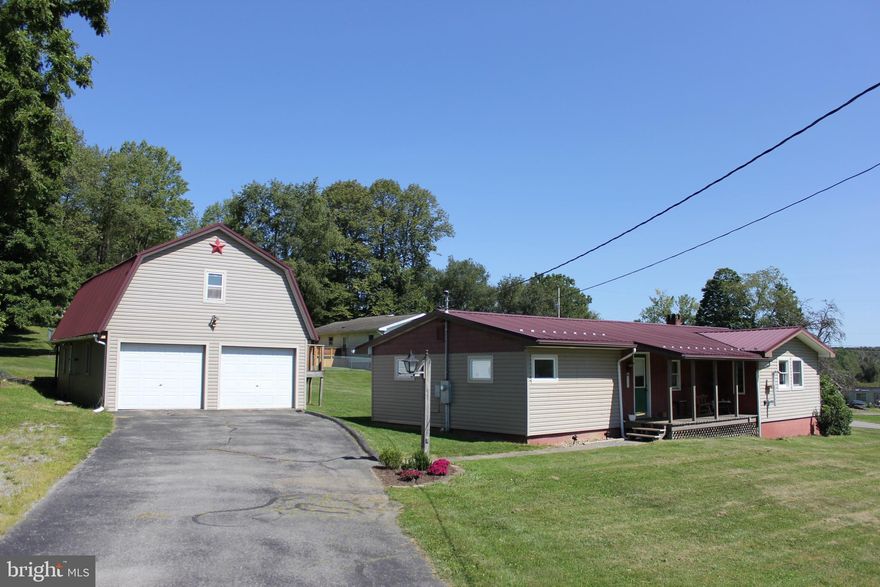 Charming 4 bedroom 1 bath ranch home. Interior freshly painted for a welcoming ambiance.  Cozy pellet stove in the open concept kitchen/living room.  Serene covered stone back patio, perfect for relaxation looking out to the backyard, all sitting on 1/2 acre lot.  Brand new roof on the garage.  The garage has a work shop and exciting potential for an apartment on second floor or just utilize it for storage.  So much to work with.   Set up your showing today!