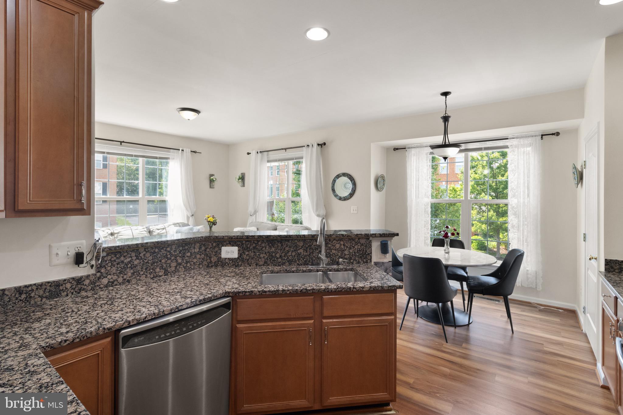 **PRICE IMPROVEMENT!!**MOTIVATED SELLERS! Step into style and sunlight in this beautifully updated end-unit townhome. The main level welcomes you with an airy, open layout ideal for both relaxed living and entertaining. The kitchen is a true centerpiece—featuring sleek granite countertops, a serving peninsula, and stainless steel appliances, including a gas range with exterior venting. A walk-in pantry and abundant cabinetry offer plenty of storage.
The adjoining family room is drenched in natural light and warmed by a cozy gas fireplace. Host guests with ease in the formal living and dining areas, or take the party outdoors to the expansive deck that stretches the full width of the home.
Upstairs, the spacious primary suite boasts vaulted ceilings, a spa-inspired bath with dual vanities, and a generous walk-in closet. Two additional bedrooms with vaulted ceilings share this level, along with a laundry room equipped with a high-efficiency LG washer and dryer.
The walk-out lower level includes a finished rec room and a closet already roughed-in for a future powder room. And don’t miss the oversized garage—it has the footprint of a 2-car garage with a single door, offering ample space for bikes, a workshop, or weekend toys.
Enjoy access to the sought-after amenities of Belmont Country Club! Seller willing to cover one-time $2,500 capital contribution fee to the HOA with full price offer.