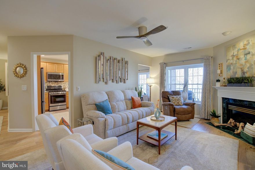 Welcome to 512 Limerick Circle, #303 nestled in sought-after Mays Chapel North. This very well-maintained two-bedroom, two full-bath condo condo exudes elegance and comfort, and modern living with its exquisite features. Step inside, you are greeted by new, wide-plank hardwood floors stretching graciously throughout the living space that welcomes you with warmth and sophistication. Ceiling fans adorned with sleek blades gracefully circulate the air, ensuring comfort during warm summer days and cozy nights alike. With quartz countertops and stainless steel appliances, the kitchen, both functional and stylish, is ideal for preparing a gourmet meal or simply enjoying your morning coffee at the breakfast area. Beyond the kitchen, you can relax in the cozy den, or step outside to the balcony  and take in the scenic wooded surroundings. The 13x15 master bedroom master bedroom is a sanctuary of tranquility, featuring plush carpeting and an expansive walk-in closet, complete with built-in shelving and ample storage space for your wardrobe essentials. The newly painted guest bedroom, with new carpet, also boasts its own walk-in closet. The exterior features many walking trails in the immediate vicinity. Close to major routes and stores including Graul’s, as well as the Mays Chapel Swim Club. You'll be right at home!