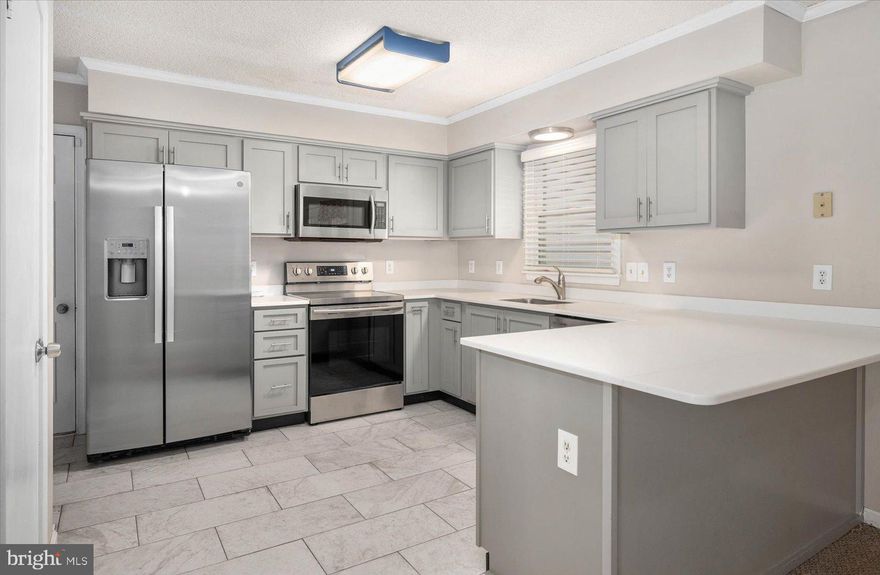 THE SELLER IS OFFERING $5K SELLER ASSISTANCE WITH AN ACCEPTABLE OFFER BY MONDAY, OCTOBER 16TH!  Welcome to this Charming 3 bedroom, 2 bath home located in the sought after neighborhood of Teal Bay in the amenity rich Ocean Pines community.   If relaxation is what you are looking for, relish the primary bedroom with its private ensuite,  and enjoy your morning coffee, or evening beverage on the screened porch just off of the upgraded kitchen, which has soft close cabinets.  There is an attic with pull down stairs for storage, and you will enjoy tinkering in your oversized garage that includes a side entrance.  The home is being sold As Is, however, you will have peace of mind knowing  in 2022, the roof was replaced, along with gutter guards being added, the water heater was replaced, as well as the washer and dryer and an upgraded kitchen faucet and single handle tub/shower valve were installed.  Not only that, but in 2023, the refrigerator which has an  ice maker, and the front stoop and stairs were replaced.  You are close to so many things, including the Golf Club, less than a 5 minute drive to the Swim & Racquet Club Pool, along with the Community Center where the Farmer's Market is held on Saturday mornings and the Ocean Pines Yacht Club, where you can listen to live music while dining waterfront.  The home was just professionally cleaned, and the carpets were steamed cleaned and is ready to welcome its next loving owners.  With a bit of TLC, you can start making memories in your new abode!