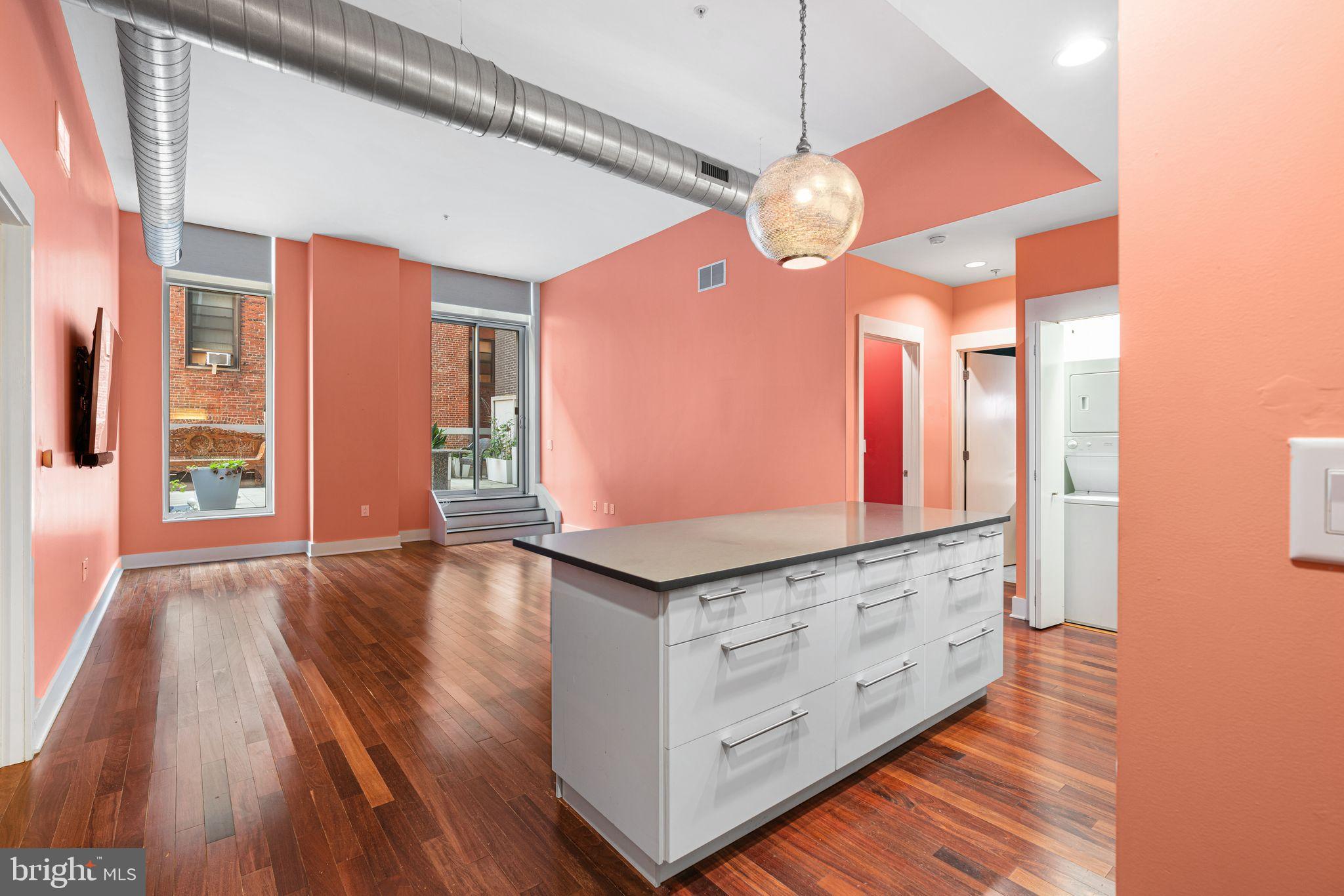 Welcome to your private oasis in the heart of the city! This sleek 2 bed, 2 bath residence immediately captivates with floor to ceiling windows that open onto an expansive 500+ sq ft private terrace. The ultimate retreat for morning coffee, yoga, entertaining, or simply unwinding after a busy day.
Inside, the thoughtful split-bedroom layout offers both comfort and privacy. The primary suite features a spacious ensuite bath with dual vanity, ceiling heater for spa-like warmth, and direct access to the terrace. The second bedroom and bath are ideal for guests, a home office, or flexible living.
At the center of the home, the custom kitchen shines with an oversized slate island that seats four, perfect for both cooking and gathering. Included with the sale are custom-installed flat screen TVs for a move-in ready experience.
Building amenities include a fitness center, 24-hour security, and secure key-card elevator access. Here, you’ll enjoy the best of city living with the rare ability to truly escape it all when you arrive home.