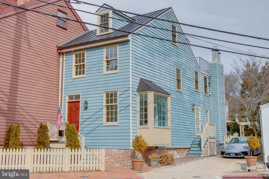 Modern Euro-luxury meets historic charm in this bright turn-key 3bed/2.5bath home in the heart of downtown Annapolis.  Located a short walking distance to the Naval Academy, City Dock, and all the restaurants and shopping of Main Street and Maryland Ave, this fully renovated home features parking for up to 3 cars, a charming fenced tiered garden area with beautiful landscaping & patio space, as well as street side cafe table space.  The interior features hardwood flooring throughout, modern high-end finishes and two fireplaces.  The second-floor front bedroom/office enjoys abundant sunlight.  The back bedroom features a private balcony overlooking the garden.  The third-floor suite includes a private bath, high ceilings and a large roof deck with views of the surrounding neighborhood and the State House and Naval Academy Chapel domes.  A fourth lower level is accessed from an exterior stairwell and provides great storage space.  With its thoughtful design, and exceptional use of space, this home is a true gem of Historic Annapolis.  Bonus fun fact: Buyers will become just the 10th family to own the location since Samuel Chase, Signer of the Declaration of Independence, lived on the property.  See MLS docs for a full list of property improvements.