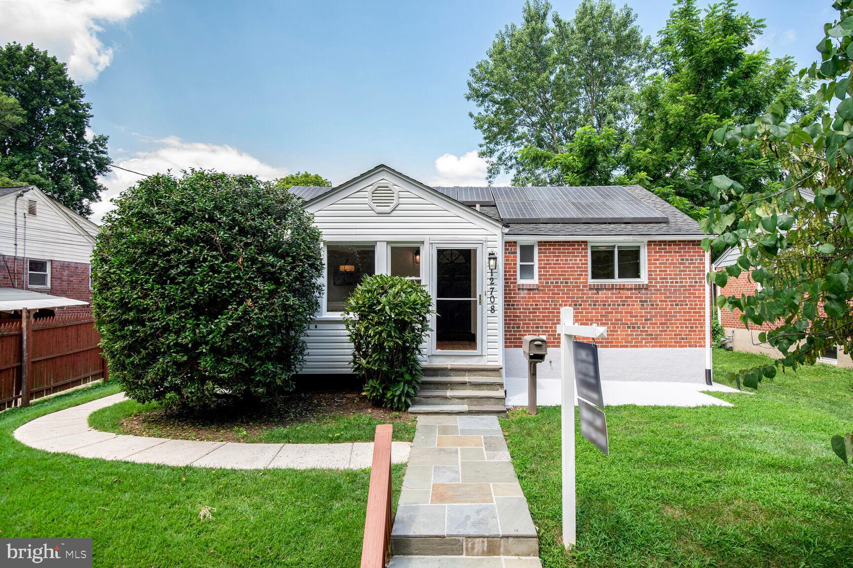 Nestled in the charming Wheaton Woods neighborhood, this expanded rambler offers a perfect blend of comfort and functionality. Built in 1952, this well-maintained brick residence boasts 1,955 sq. ft. of inviting living space, featuring fresh neutral paint, new upgraded kitchen appliances, light fixtures, upgraded new carpet, four spacious bedrooms (including a two bedroom addition) and two full bathrooms. Step inside to discover a warm ambiance enhanced by a 4-season room complete with a built in storage bench. The traditional floor plan seamlessly connects the dining and living areas, perfect for gatherings. The upgraded kitchen is equipped with new stainless steel appliances, including a gas range, built-in microwave and upgraded refrigerator. The kitchen includes a new natural gas oven and is complemented by brand new elegant quartz countertops and ample cabinetry. A bonus room across from the kitchen may be used as an additional eating area or home office. The home offers a separate side entrance. The fully finished basement adds valuable living space, complete with shelving and a cozy atmosphere, making it perfect as a family recreation room, game and craft area . Enjoy the convenience of a upgraded full bathroom and a large laundry area with washer and dryer along with a brand new utility sink and additional storage. Outside, the property features a lovely front and fenced in rear yard, ideal for outdoor activities or gardening. A shed provides additional storage for tools and equipment. Sidewalks throughout the neighborhood encourage leisurely strolls and a sense of community. Home faces wooded parkland (no houses). This home is ready for you to create lasting memories. Don’t miss the opportunity to make this charming residence your own!