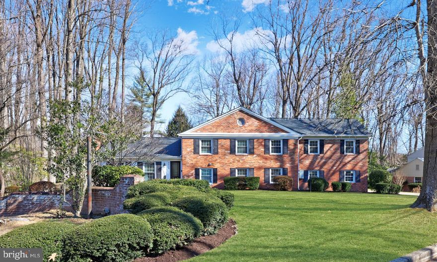 Must see in Barcroft Woods!!! This home has been completely remodeled with flawless style and openness to match the most discerning tastes. As well, it has been expanded to add a second, gorgeous primary bedroom suite and an oversized two-car garage. The heart of the home is its stunning, airy kitchen with quartz countertops, white cabinetry, KitchenAid stainless steel appliances, roaring gas fireplace, soft recessed lighting, informal eat-in island, and formal dining space. Rich hardwoods run throughout the home. Upstairs, you'll find FIVE bedrooms and three fully renovated bathrooms, including TWO spacious primary suites—both featuring a walk-in closet and both suites offering beautifully updated en-suite baths. The lower level offers refined flexibility, featuring a large entertainment room that walks out onto the stately stone patio, a home office, a toy room/sixth bedroom, full bathroom, and a mud room that connects to the oversized garage.  A fourth level features a laundry room, storage, and a gym area. As if that wasn't enough, this home provides its owners with a pasture-like 0.89-acre lot that includes expansive and flat open space, a brick front shed with power supply, a private playground, a cozy deck, and the beautiful stone patio. The sellers have not neglected any detail of this home and have added a new roof (2022), HVAC system (2021) and a whole house natural gas generator. Conveniently located just minutes from Arlington, Alexandria, and D.C., this home offers easy access to Metrobus routes and nearby parks, including Holmes Run Stream Valley Park, Mason District Park, and Barcroft Knolls Park—ideal for biking, kayaking, and mini golf. Don't miss this beautifully updated home in a fantastic location!