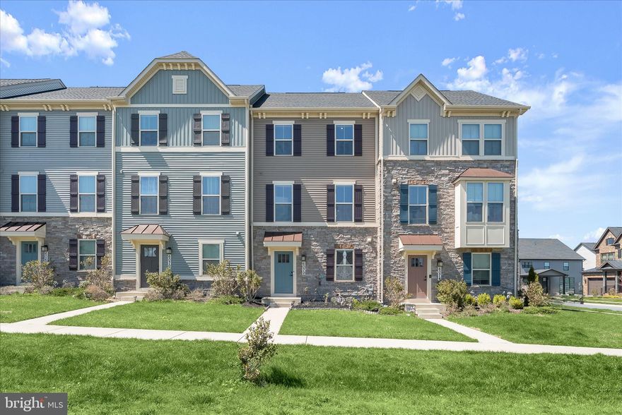 Welcome to 6072 Fallfish Court, a stunning four-level townhome located in the desirable Oakdale Village at Lake Linganore, offering five bedrooms and four and a half baths with beautifully designed living spaces throughout. The entry level welcomes you with two convenient coat closets, a private bedroom, full bath, and interior access to the garage ideal for guests, a home office, or multigenerational living.
Upstairs, the main living level features an expansive and light-filled layout with a bright dining area and family space centered around a gorgeous kitchen appointed with luxury vinyl plank flooring, quartz countertops, a center island with breakfast bar, stainless steel appliances, pantry, and a charming coffee station. The dining area opens directly to an oversized Trex balcony, perfect for outdoor dining or relaxing. This level also includes a spacious living room with plush carpeting and a convenient powder room.
The upper level is highlighted by the serene primary suite featuring an en-suite bath with dual vanities, a soaking tub, and a glass-enclosed shower. Two additional bedrooms, a full hall bath, and a laundry area complete this level. The top floor offers incredible flexibility with an expansive fifth bedroom or entertainment room, complete with a full bath and access to a huge rooftop deck, an exceptional space for entertaining or enjoying the views.
Life at Lake Linganore brings resort-style amenities right to your doorstep, including private beaches, pools, clubhouses, boat ramps, piers, paddle sports, tennis and volleyball courts, disc golf, tot lots, summer concerts, farmers markets, and miles of scenic trails. All of this is just minutes from the shopping, dining, and entertainment of Frederick and Urbana, with easy access to I-70, MD-75, and Route 40 for an effortless.