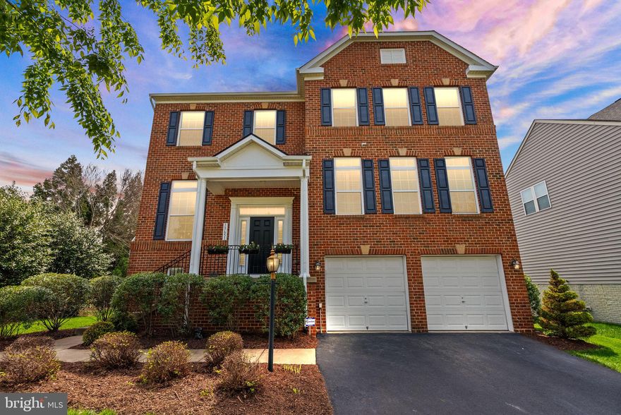 Welcome to your dream home in the highly sought-after Wentworth Green community in Gainesville, VA - a stunning home that truly shows like a model with no expense spared. Boasting nearly 4,500 square feet of meticulously maintained living space, this 4-bedroom, 4.5-bathroom home is a rare find for buyers who value luxury, comfort, and convenience. Perfectly positioned on a premium corner lot, this home enjoys added privacy  with HOA-maintained common area adjacent to both the side and rear of the property - offering the feel of a much larger outdoor space without the maintenance. From the moment you enter, you'll be captivated by the gleaming hardwood floors that lead into the home. The kitchen is a chef’s delight, complete with stainless steel appliances, granite countertops, and ample cabinetry - perfect for both daily living and entertaining. The main level also offers a private office, formal dining room, living room with a cozy gas fireplace, and a sun-filled morning room overlooking the backyard oasis. Step outside and fall in love with the three-level Trex deck, 700 square foot 2 level stamped concrete patio, and built-in audio and lighting system, creating the ultimate outdoor entertaining space. The beautiful water feature and maintenance-free Trex privacy fencing add to the ambiance, making the backyard feel like a private retreat. Upstairs, the primary suite is a true sanctuary with tray ceilings, a luxurious bathroom with soaking tub, and two spacious walk-in closets. There are three additional generously sized bedrooms on the upper level along with the laundry room for convenience. The walk-out basement is a showstopper with a professionally installed theater room, pool table area, bonus room, and a full bath - ideal for entertaining or relaxing. Enjoy the unbeatable location - walking distance to Virginia Gateway and Promenade Shopping Centers, Lifetime Fitness, and just minutes to Route 66, 29, and 15, making commuting a breeze. This home checks every box for today's discerning buyer - spacious, stylish, and perfectly located. Don't miss the opportunity to own this exceptional property in one of Gainesville's most desirable neighborhoods.