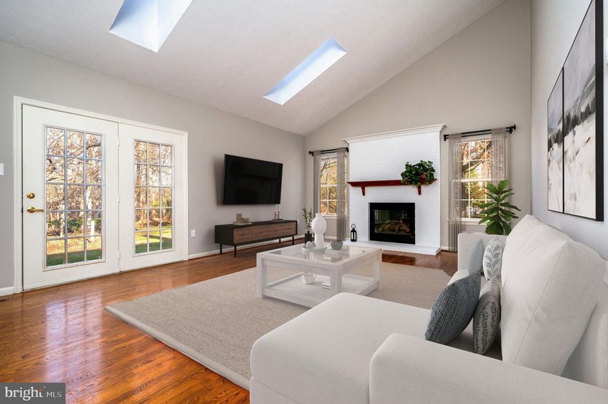 STOP BY TO TOUR THE OPEN HOUSE 1 to 3PM THIS SUNDAY DEC 7 - Start 2026 off right in your next home!  This expansive, beautifully maintained home offers over 4,000 square feet on 3 finished levels!  The sun filled two story entryway has gleaming natural hardwoods that flow through the main level.  There is a spacious living room and separate dining room for entertaining, kitchen with a brand-new stainless stove & range hood, granite countertops, center island, and double-door pantry.  
The breakfast area of the kitchen has a large bay window and backyard views. The open-concept family room has soaring vaulted ceilings, a gas fireplace, and French doors to the back patio.  Conveniently located between the kitchen and the oversized 2-car garage, the laundry room has new LVP flooring and updated appliances.  The first-floor office with a closet offers versatility to possibly serve as a fifth bedroom if needed.  There is also a half bath just off the main hall.  New in 2025-plush carpeting, fresh neutral paint on the main and upper levels, stove & range hood, some new lighting, ceiling fans & electrical, LVP flooring.  

The upper level offers an expansive primary suite,  a walk-in closet,  owner's spa-like bath with double sinks, soaking tub, separate shower and additional closet.  There is also a large sitting area which could easily convert to a 2nd office or nursery if needed, The remaining upper level offers three generous sized bedrooms and main hall full bath.
Retreat from the daily rush to the lower level recreation room for movies or game time. Remodeled in 2022 with hard-surface flooring and neutral paint, the basement offers another finished room perfect for a gym, playroom, or accessory guest room.  The is a rough-in for a bath in the large storage /utility room, and walk-up steps to the backyard.  
Come see the neighborhood perks in Russett!  Community pools, tot lots, sidewalks and wooded trails for hiking/biking, tennis courts, basketball, and a library to enjoy.  Close by restaurants and shopping, NSA, Ft Meade, JHUAPL, Rts 198, 32, 295, BWI and MARC Train for commuting to Baltimore and Washington.  Call your agent today to schedule a showing! (Some photos virtually staged.)