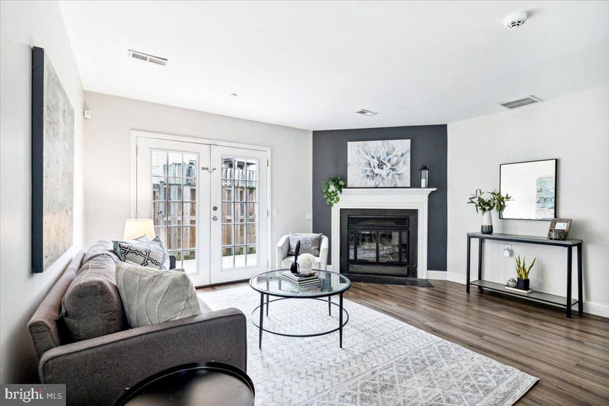 **OFFER DEADLINE 10/11 at Noon!** Welcome to this beautifully updated townhome in the sought-after Crestwood Village! As you enter, you are greeted by luxurious vinyl plank flooring and soaring high ceilings that create an inviting, open space. The living room features a cozy wood-burning fireplace and double doors that lead to a private exterior patio—perfect for relaxing or entertaining. The bright, modern eat-in kitchen boasts modern updates, including sleek stainless steel appliances and, an undermount sink. Additionally, on the main level, you'll find a versatile room that can serve as a bedroom or home office, along with a full bathroom. The upper level offers a convenient laundry area is thoughtfully placed for easy access. The primary suite is a true retreat, offering a generous walk-in closet and a private en-suite bathroom. An additional bedroom completes the upper level. Outside, enjoy your own patio space surrounded by a privacy fence, offering both comfort and seclusion. Crestwood Village offers a range of amenities, including a community pool, clubhouse with shuffleboard, and more! Located just minutes from downtown Frederick, with easy access to major commuter routes like I-70, I-270, and Route 15, this home perfectly blends modern living with prime convenience. Welcome home! **NO AGE RESTRICTIONS**