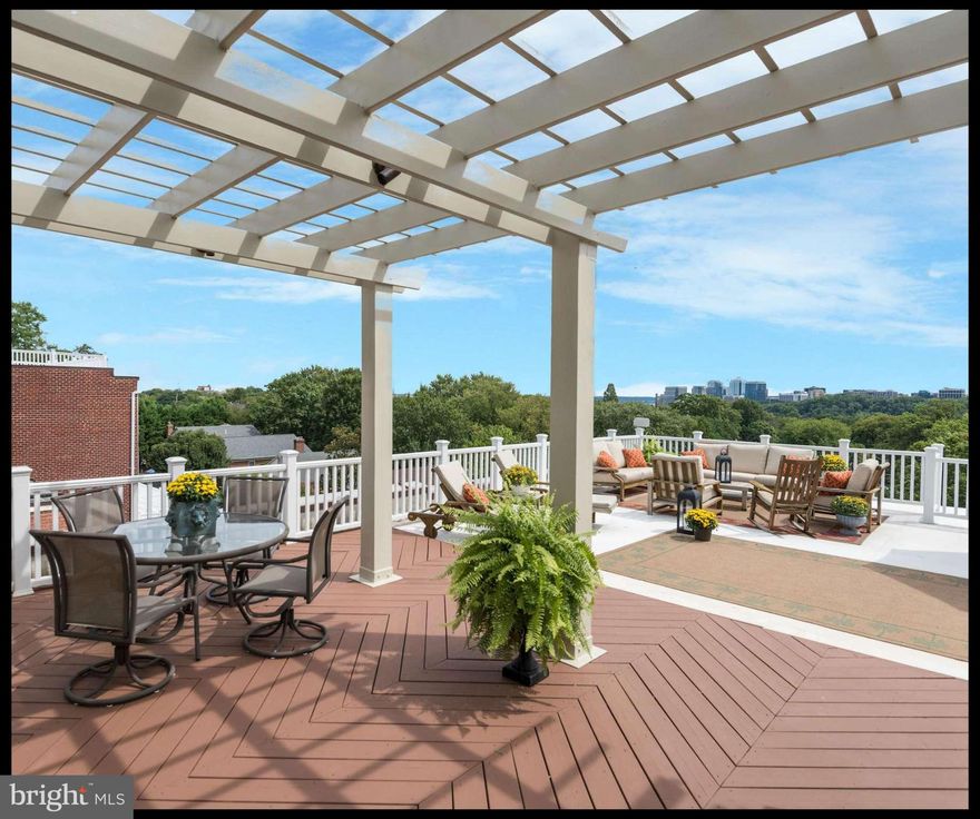 This property is DRAMATIC! Impressive scale w 10' ceilings, jaw-dropping roof deck w Monument & Rosslyn views, huge windows fill house with light, 5BRs, 4f & 2h BAs, 7600 sf on 5 levels, 4+ car Garage, elevator, spacious MBR renovated w His & Her Baths and walk-in closets. Turn-key move right in condition! Secluded yet convenient location w easy access to dwntwn, VA, MD. MUST SEE!