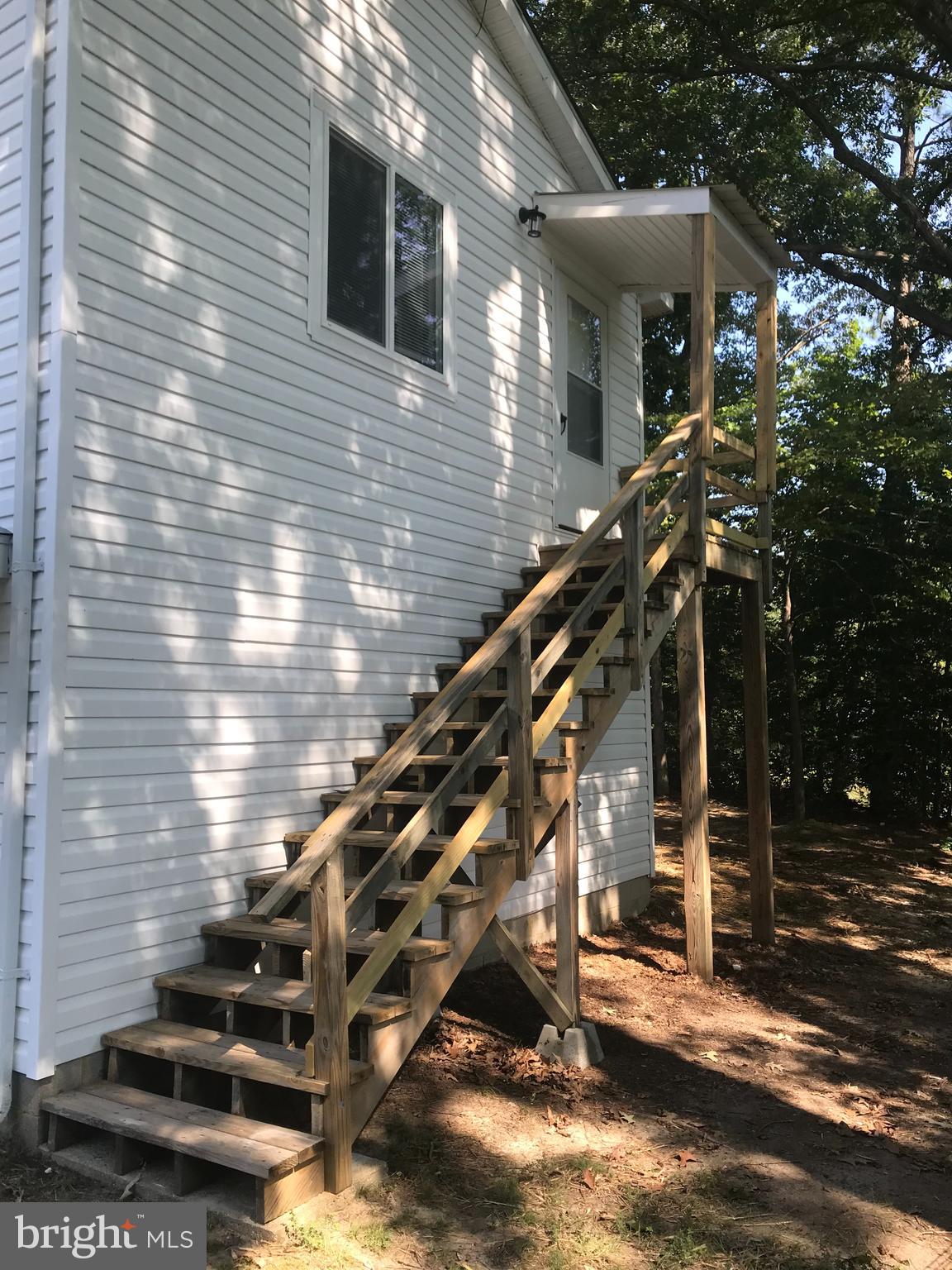 Check out our 3D walk through - better than photos! Live in peaceful St. Inigoes, MD with water view. Be the first to rent this lovely one bedroom, one bath second floor apartment. Owner installed beautiful finishes to include luxury vinyl plank flooring throughout, cherry kitchen cabinets and ceiling fans. The washer and dryer are in the unit and ready to go. Heating and cooling via ductless mini-split units. Rent includes electric, water, sewer and trash. The apartment was constructed over the detached garage, You have a private entrance and do not share any living space with the main unit occupant.
Close to NESEA/Webster Field (1 miles) and Pax River Naval Air Station (12 miles - easy drive from the south). Please do not drive by without a scheduled appointment as the main house is already occupied.