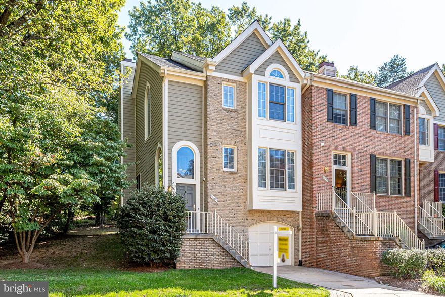Gorgeous end-unit townhouse available in North Reston. Elegant and private townhome with beautiful views of nature. Charming neighborhood, walking distance to North Point Shopping Center with restaurants and stores all close to home,  easy walk to North Hills Pool with tennis courts and Lake Newport with basketball courts.
This home has an attractive façade with a brick and cedar exterior and box bay window.  Enter the expansive foyer framed by two large transom windows. Just a short flight of stairs up to the large living room with beautiful hardwood floors, and wood-burning fireplace with stone hearth.  Private deck off of living area with view of trees. Formal dining room adjacent to the living room and kitchen perfect for entertaining.  Beautiful kitchen with stainless steel appliances including gas range,  gorgeous granite counters, and white cabinets, opens up to large breakfast/family  room.  Follow stairs up to the primary bedroom suite with vaulted ceilings, walk-in closet, and a large bathroom with newer tile floors, soaking tub, and dual vanity. Two more bedrooms upstairs share a hall bath with a shower/tub.  Access the lower level from the foyer to a large second family room  with a second cozy fireplace, this one gas. This room can easily convert into a second family room, den, media/movie room, or exercise room. Thank you for your interest.