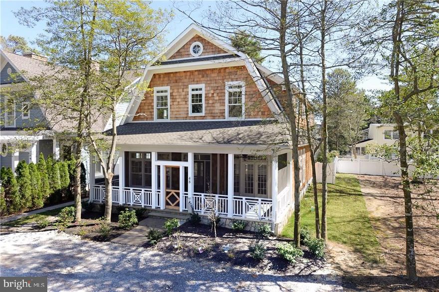 Like NEW 5BR, 5.5BA Park Paradise located on coveted Park Ave. & just a block to exclusive Deauville Beach & easy walk to Rehoboth boardwalk, restaurants, shops & bike ride to Lewes, Cape Henlopen State Park. Sip your morning coffee on the front porch, meditate to the sounds of the birds in this unique park like setting.  Have cocktails & barbeque on your private back porch w/ comfy seating & outside shower.  Featuring an open floor plan, Fireplace, Gourment kitchen, a chefs delight w Wolf & Sub-Zero, Granite, Hardwoods.  5 En-Suite Bedrooms w Carrera marble bathrooms. 1st  Floor MBR, DR, Sunroom.  Full Basement. NEMA 14-50 charger for Electric Car.  Rental income $115K+